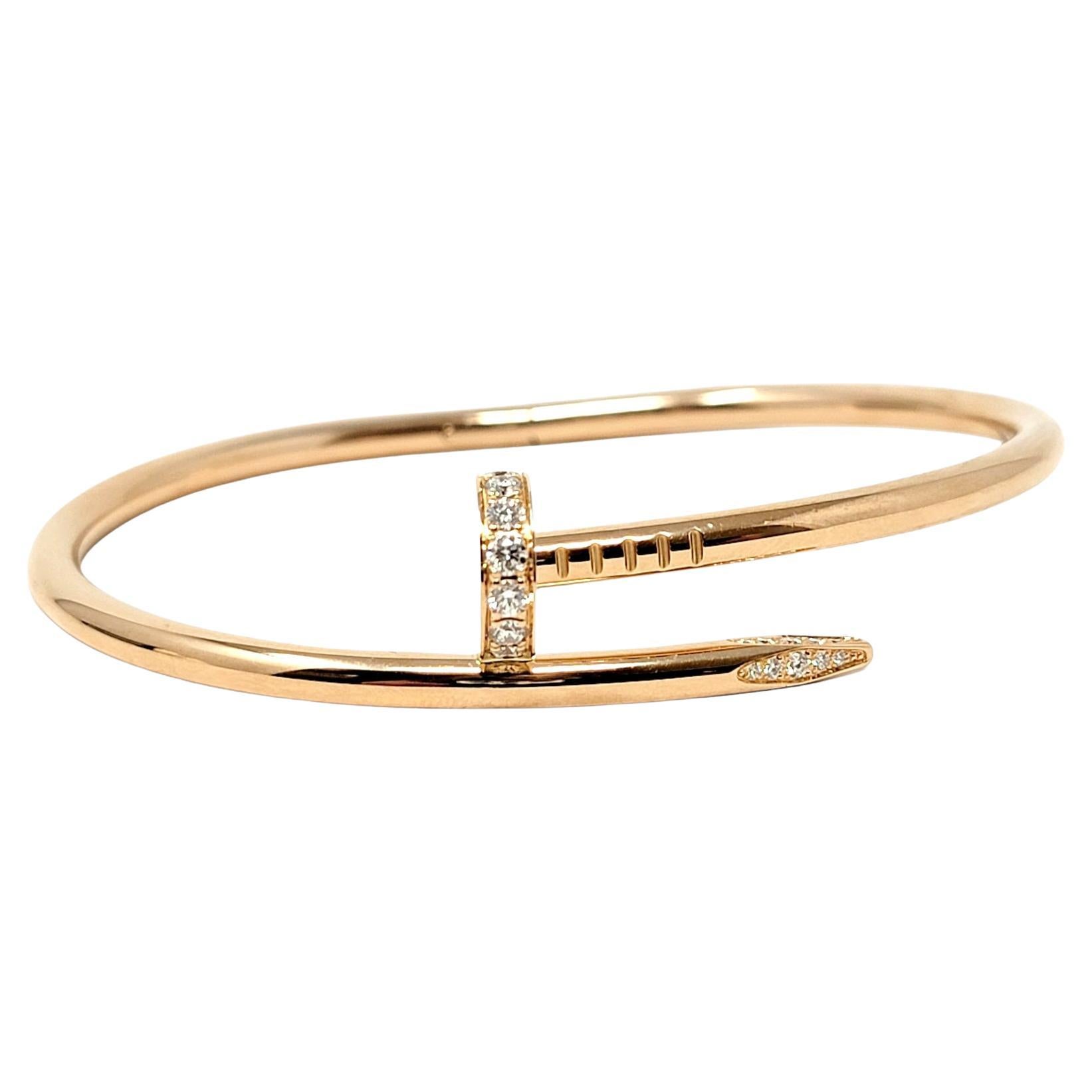 Iconic Juste un Clou hinged bangle bracelet from luxury jeweler, Cartier, is simply stunning. This timeless 18 karat rose gold piece makes a chic statement on the wrist. With its clean lines, sparkling diamond accents, and flawless elegance, this