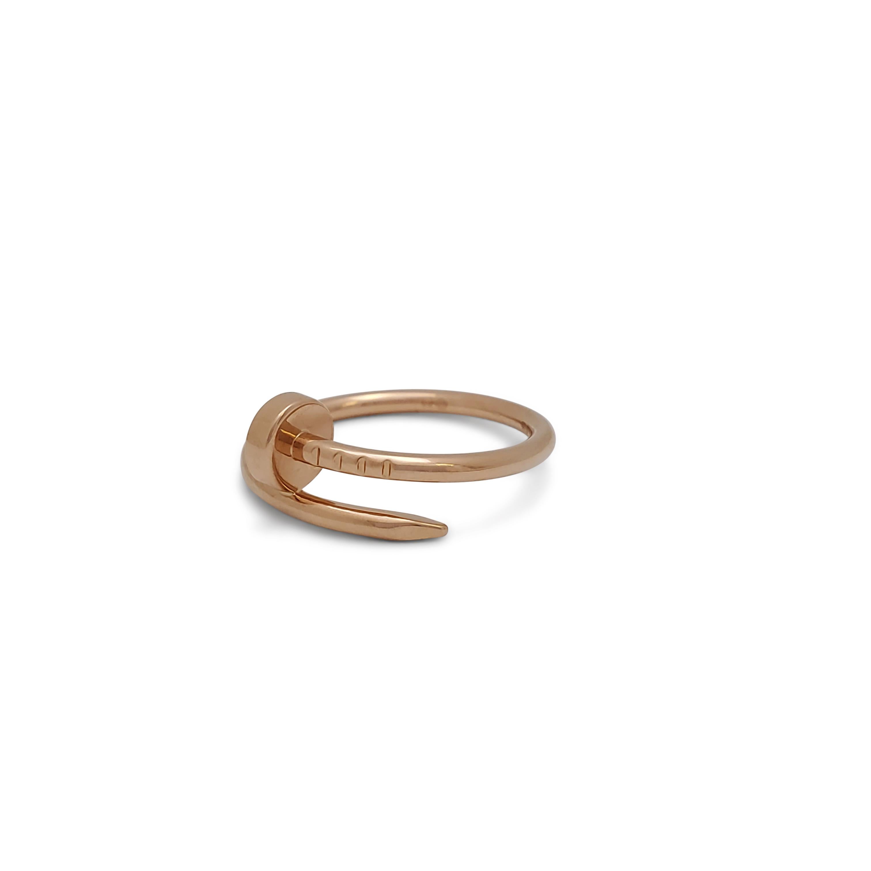 Designed as a 'just a nail', this authentic Cartier 'Juste un Clou' ring is modern, transcending the everyday, yet bold. The nail ring is an innovative twist on a familiar and ordinary object. Signed Cartier, 51, Au750, with serial number. Ring is