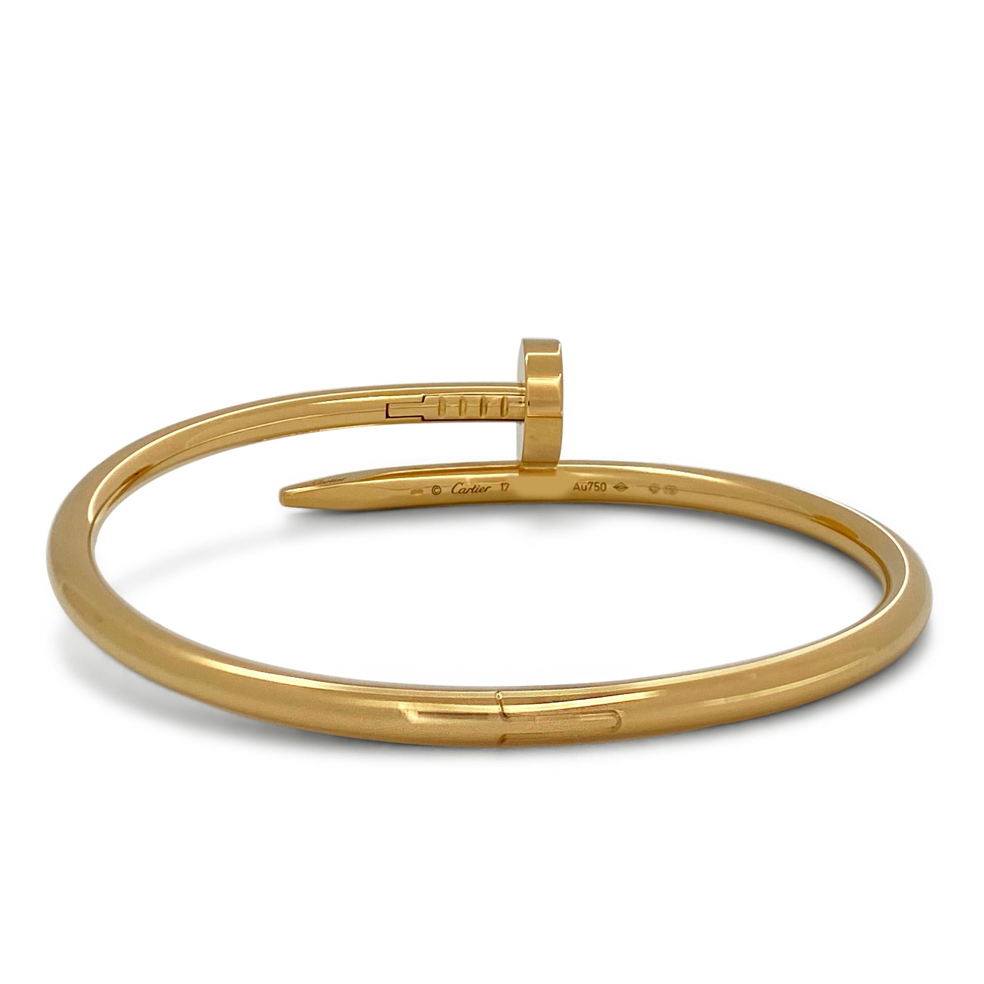 Designed as a 'just a nail', this authentic Cartier 'Juste un Clou' bracelet is modern, transcending the every day, yet bold. The nail bracelet is an innovative twist on a familiar and ordinary object. Signed Cartier, 17, Au750. Bracelet is 3.5mm in