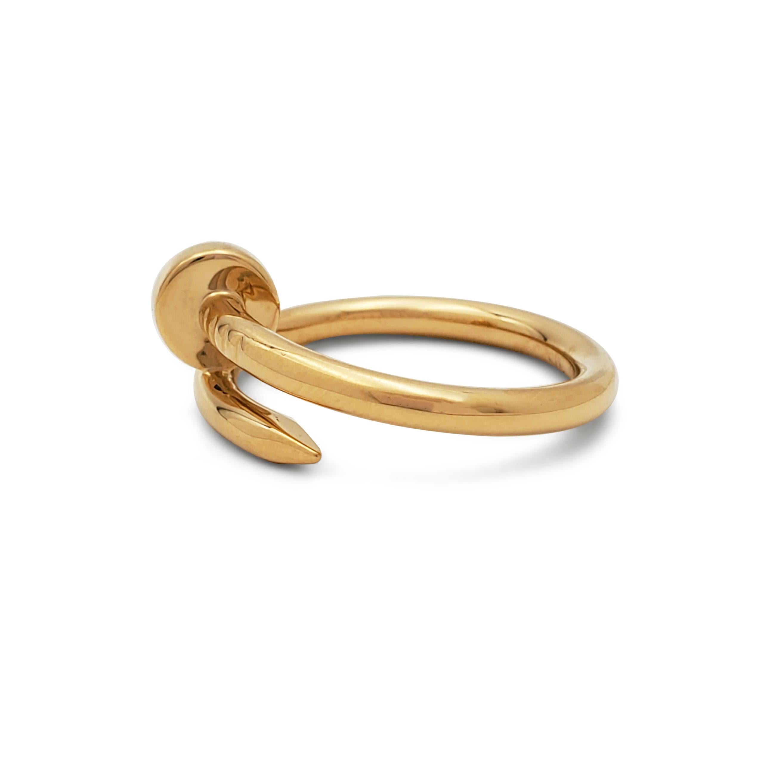 Designed as a 'just a nail', this authentic Cartier 'Juste un Clou' ring is modern, transcending the every day, yet bold. The nail ring is an innovative twist on a familiar and ordinary object. Size 62, 2.65mm wide. Signed Cartier, 62, Au750, with