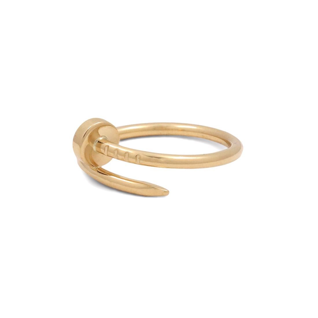 Designed as a 'just a nail', this authentic Cartier 'Juste un Clou' ring is modern, transcending the every day, yet bold. The nail ring is an innovative twist on a familiar and ordinary object. Ring is 1.7mm in width and a size 52 (6 3/4 US). Signed