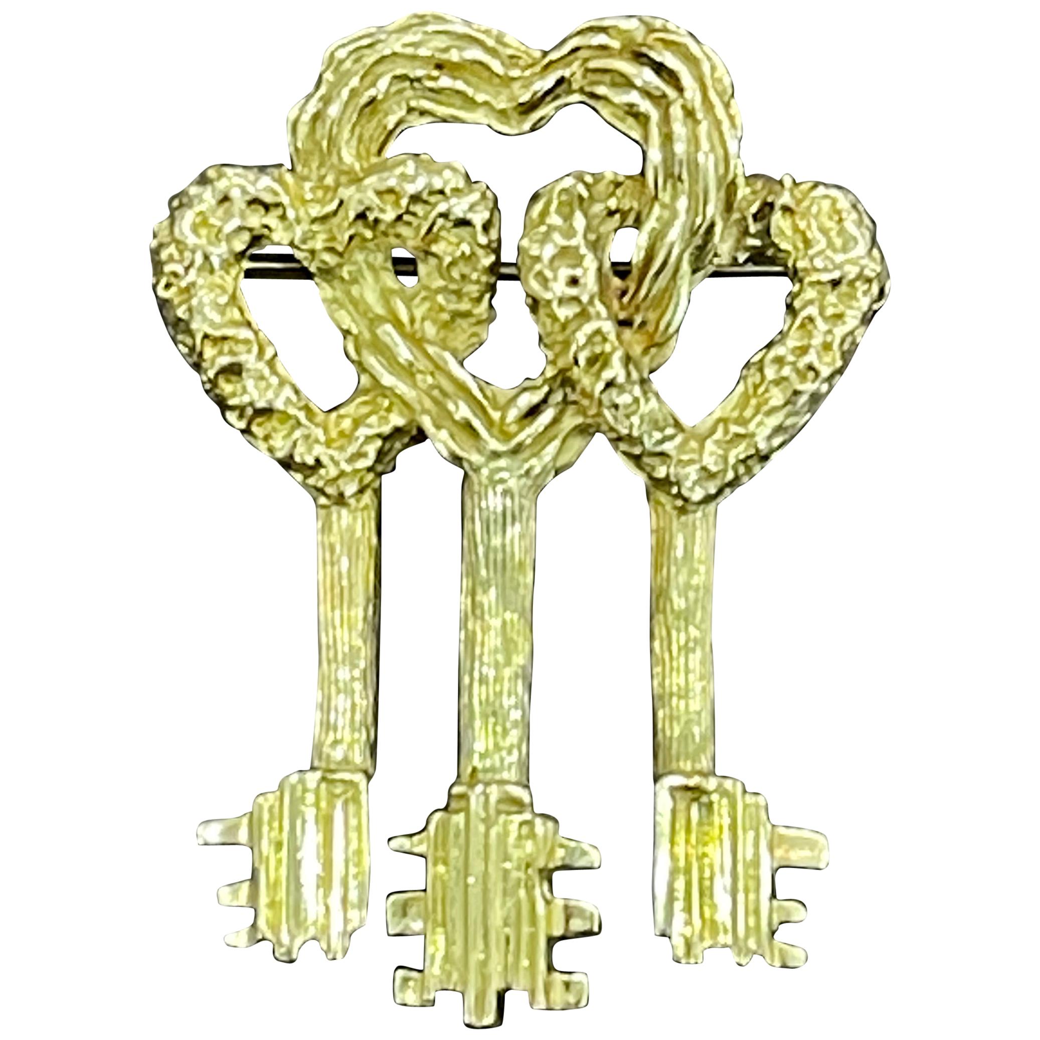 Cartier Key to My Heart 18 Karat Yellow Gold Three Heart Textured Key Pin Brooch For Sale