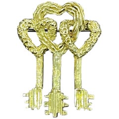 Antique Cartier Key to My Heart 18 Karat Yellow Gold Three Heart Textured Key Pin Brooch
