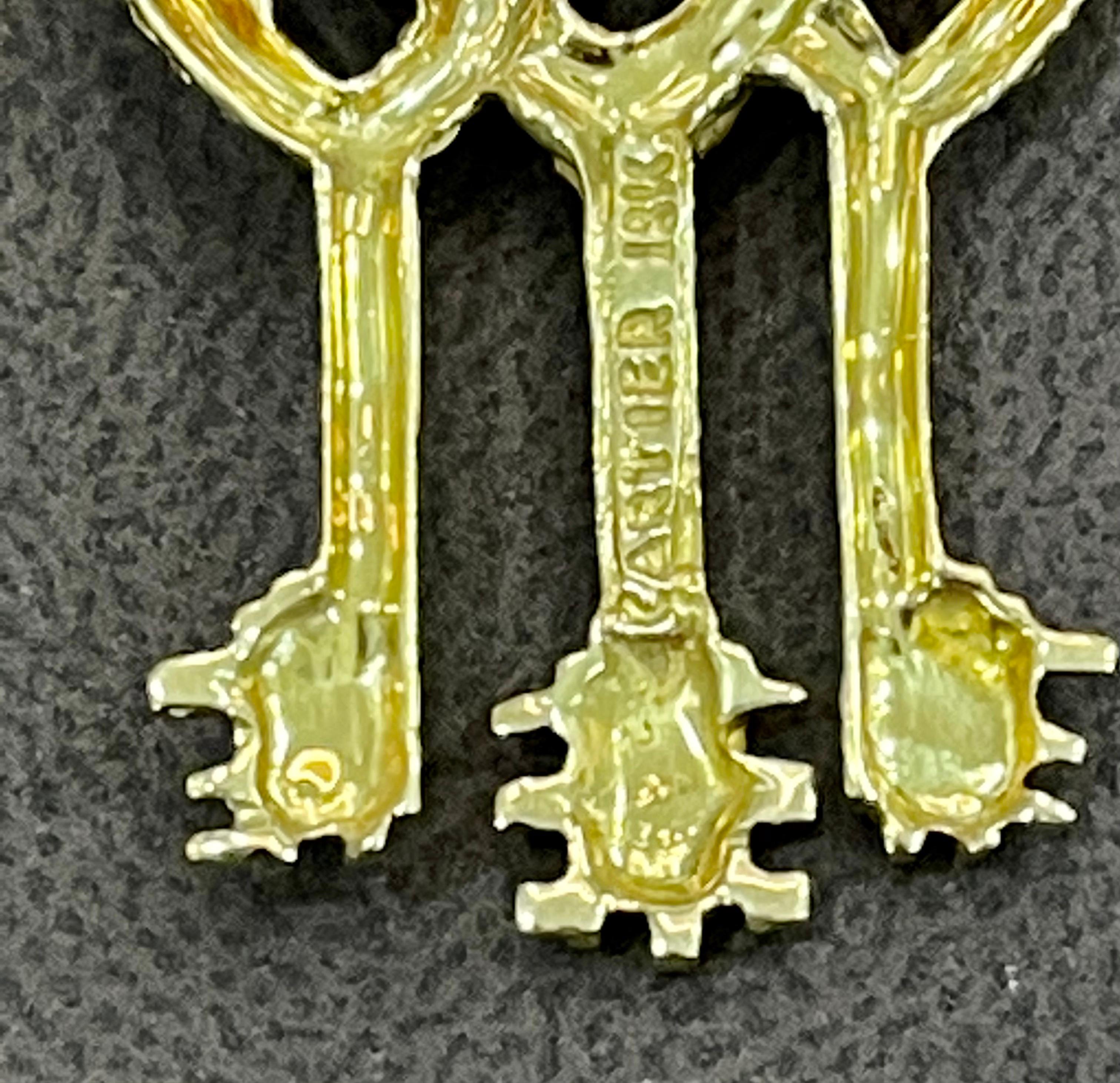 A Cartier Key to My Heart Brooch

A beautiful  pin made by Cartier depicting three intertwined heart keys held together by a magnificent Design

Signed Cartier

18 karat gold 12 Grams
brooch/pin measures 42mm long x 30mm at widest point. MARKED: