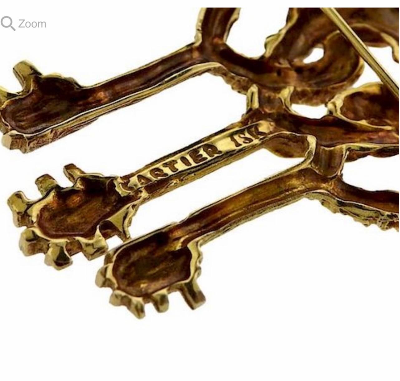 Cartier Key to My Heart 18 Karat Yellow Gold Three Heart Textured Key Pin Brooch In Excellent Condition For Sale In New York, NY
