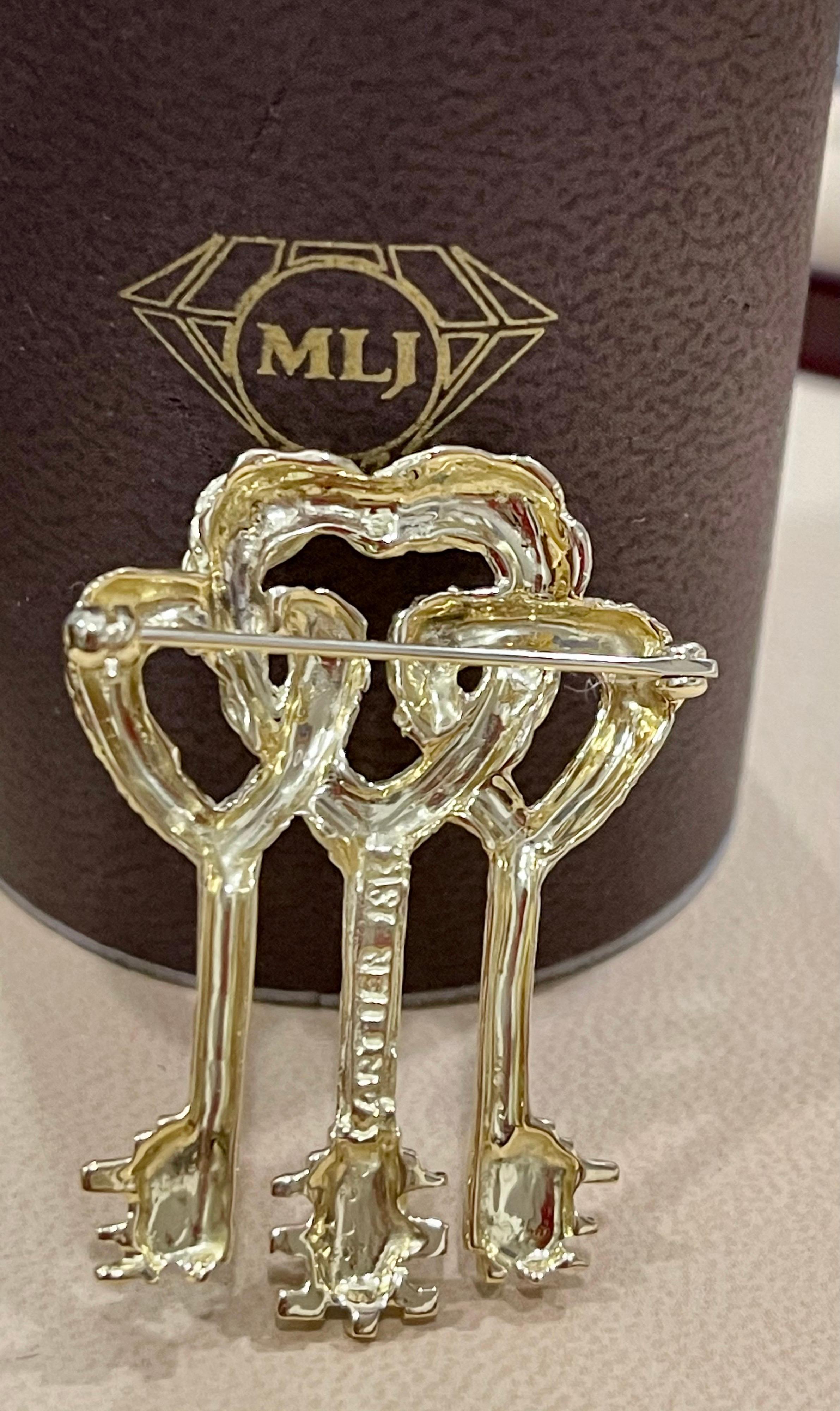 Women's or Men's Cartier Key to My Heart 18 Karat Yellow Gold Three Heart Textured Key Pin Brooch For Sale
