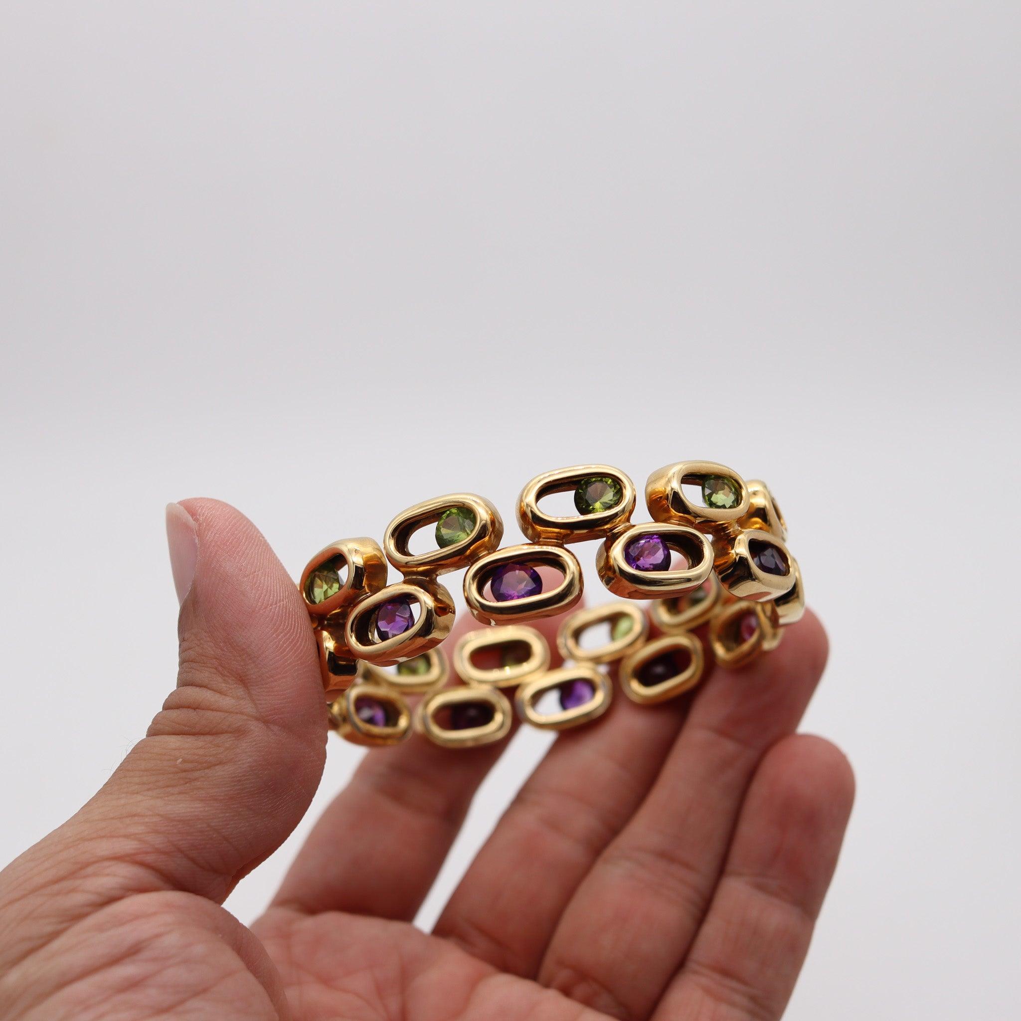 CARTIER Kinetic Geometric Bangle In 18Kt Yellow Gold With Peridots & Amethystes In Excellent Condition For Sale In Miami, FL