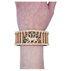 Cartier l Gold, Coloured Stone and Diamond 'Panthere' Bracelet.