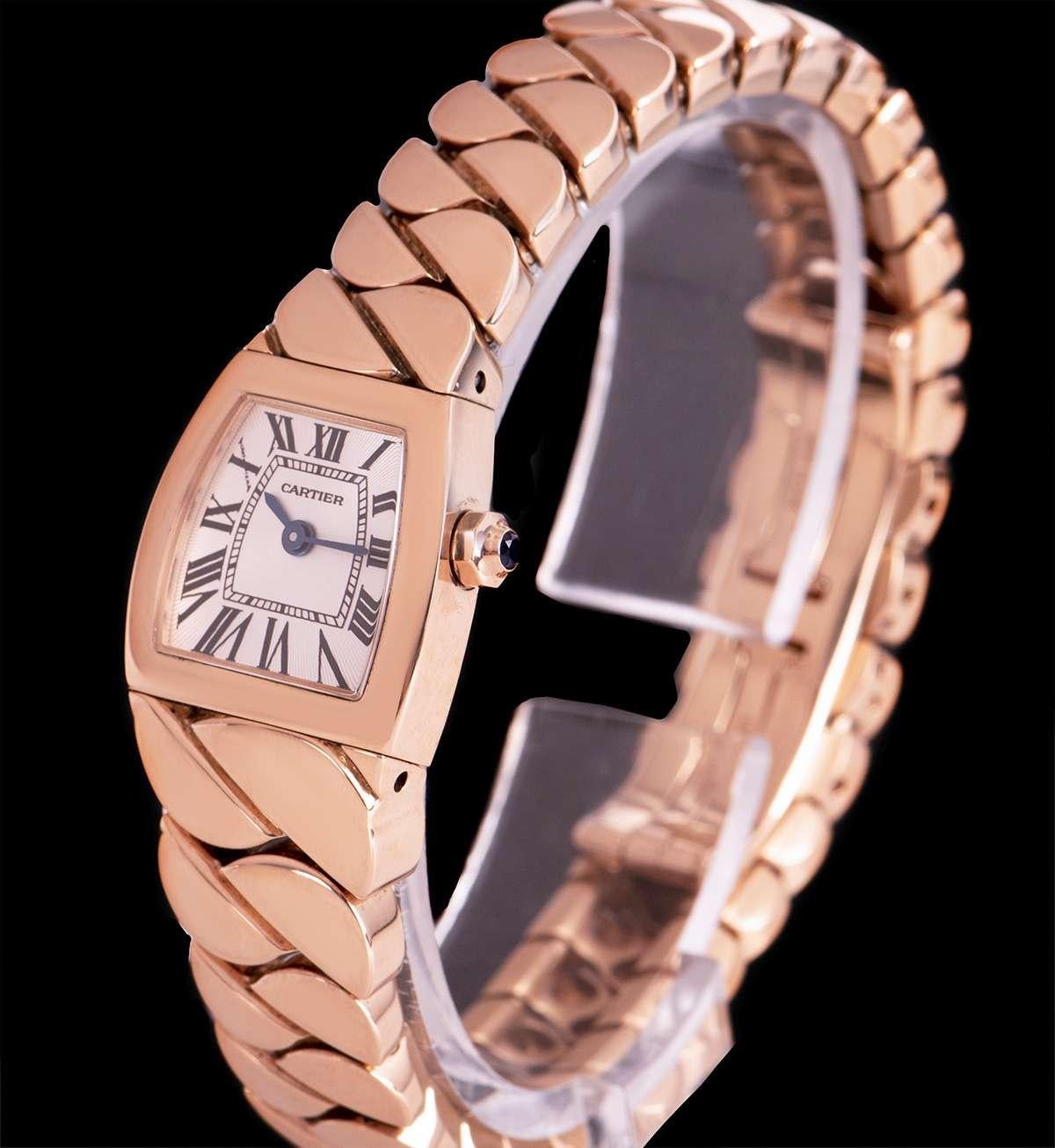 A 18 mm Mini La Dona women's wristwatch, by Cartier

Crafted from 18k rose gold, the watch features a silver dial with sapphire crystal, an 18k rose gold bracelet with a concealed double deployant clasp.

The watch is powered by a quartz movement,