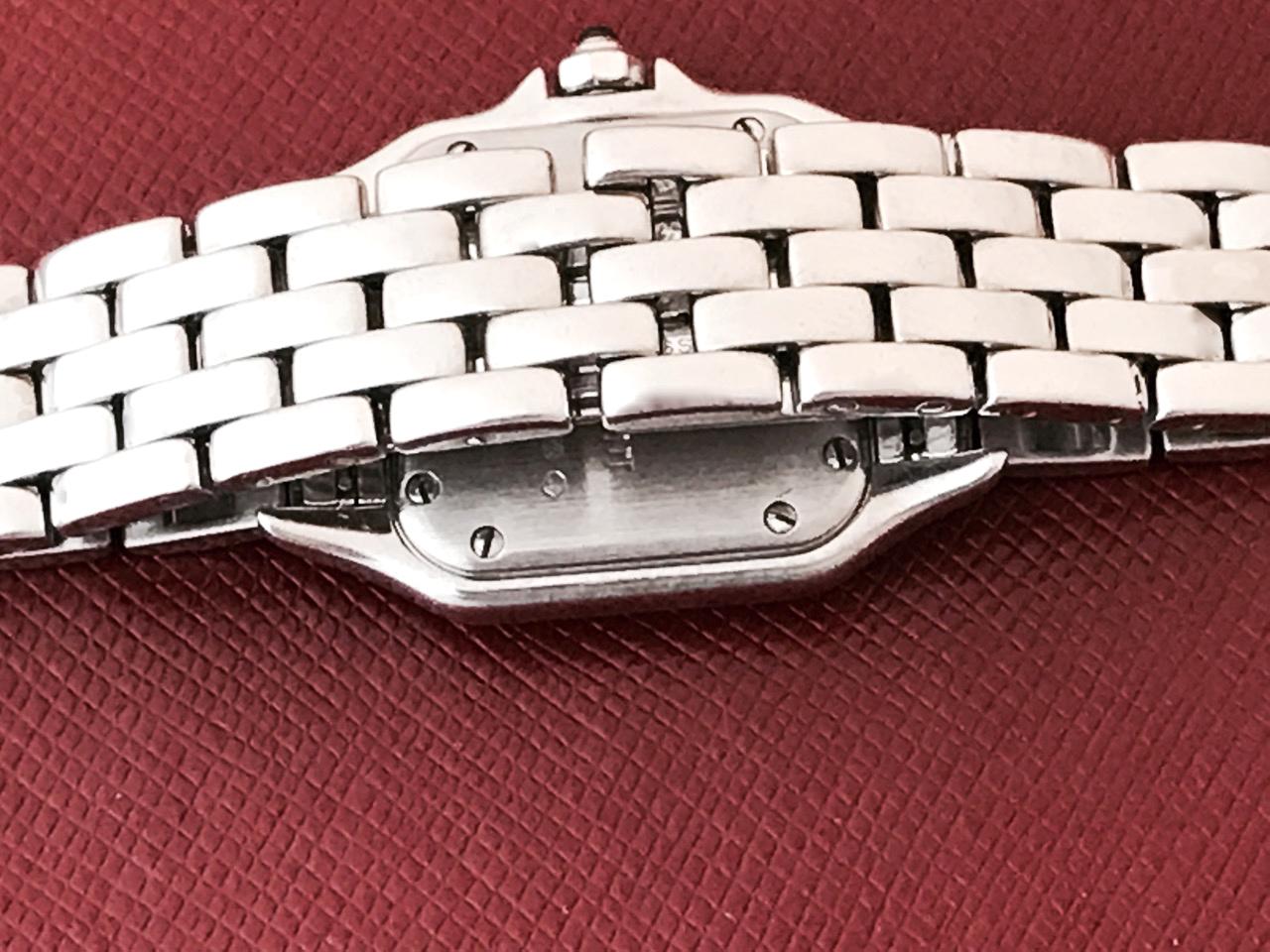 Cartier Ladies Panther Model W25022B9 18k White Gold Wrist Watch.  Quartz movement.  18k White Gold square style case with blue sapphire cabachon setting crown (21x30mm). 18k White Gold bracelet with deployant clasp. White Dial with black Roman