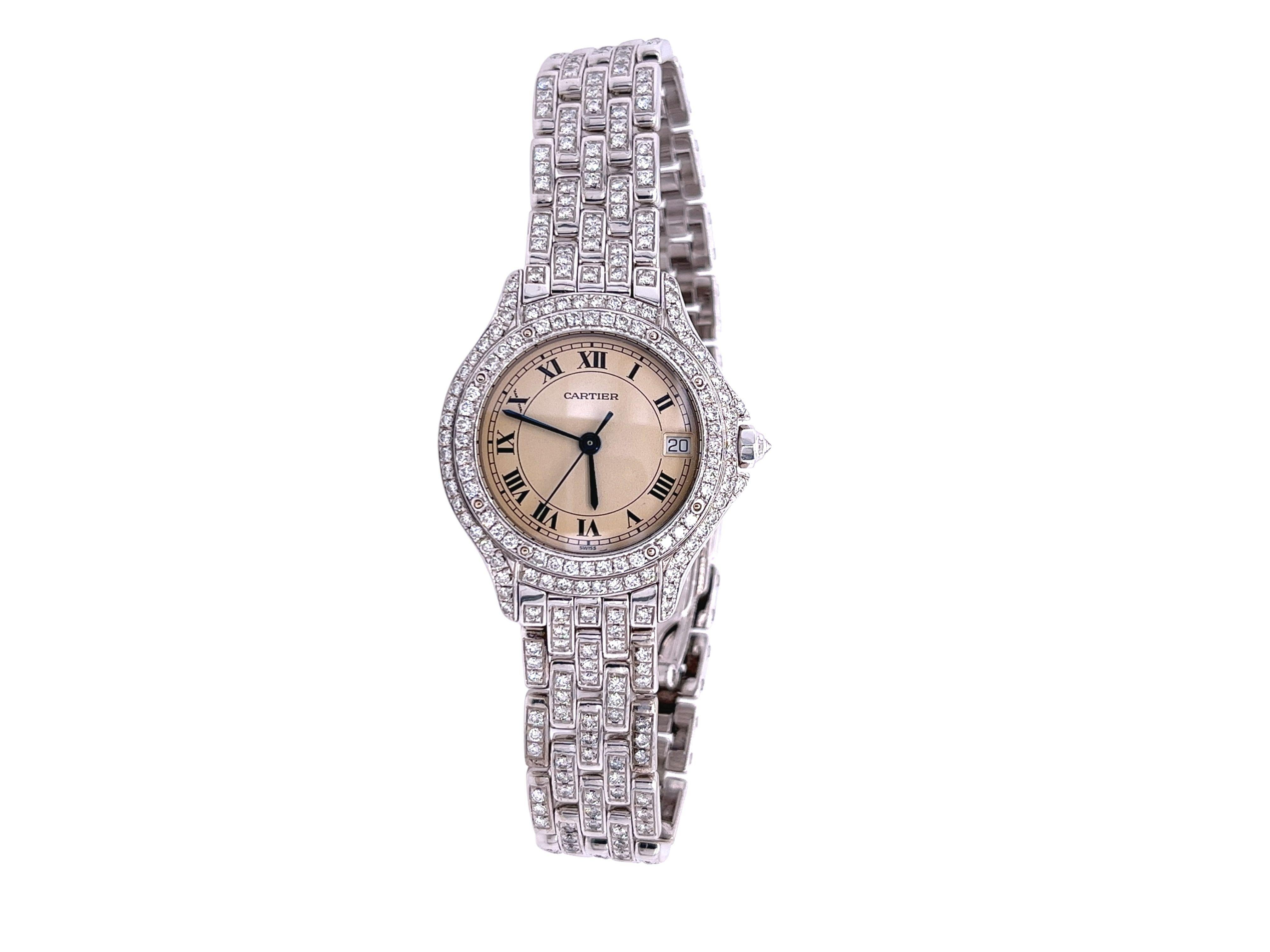 18K white gold Cartier quartz movement wrist-watch with diamonds. This Watch features a caliber 687, date bubble, and  328 round brilliant diamonds of approximately 3.28 carats, Clarity-VS2, Color-G. This vintage diamond Cartier watch is a legendary