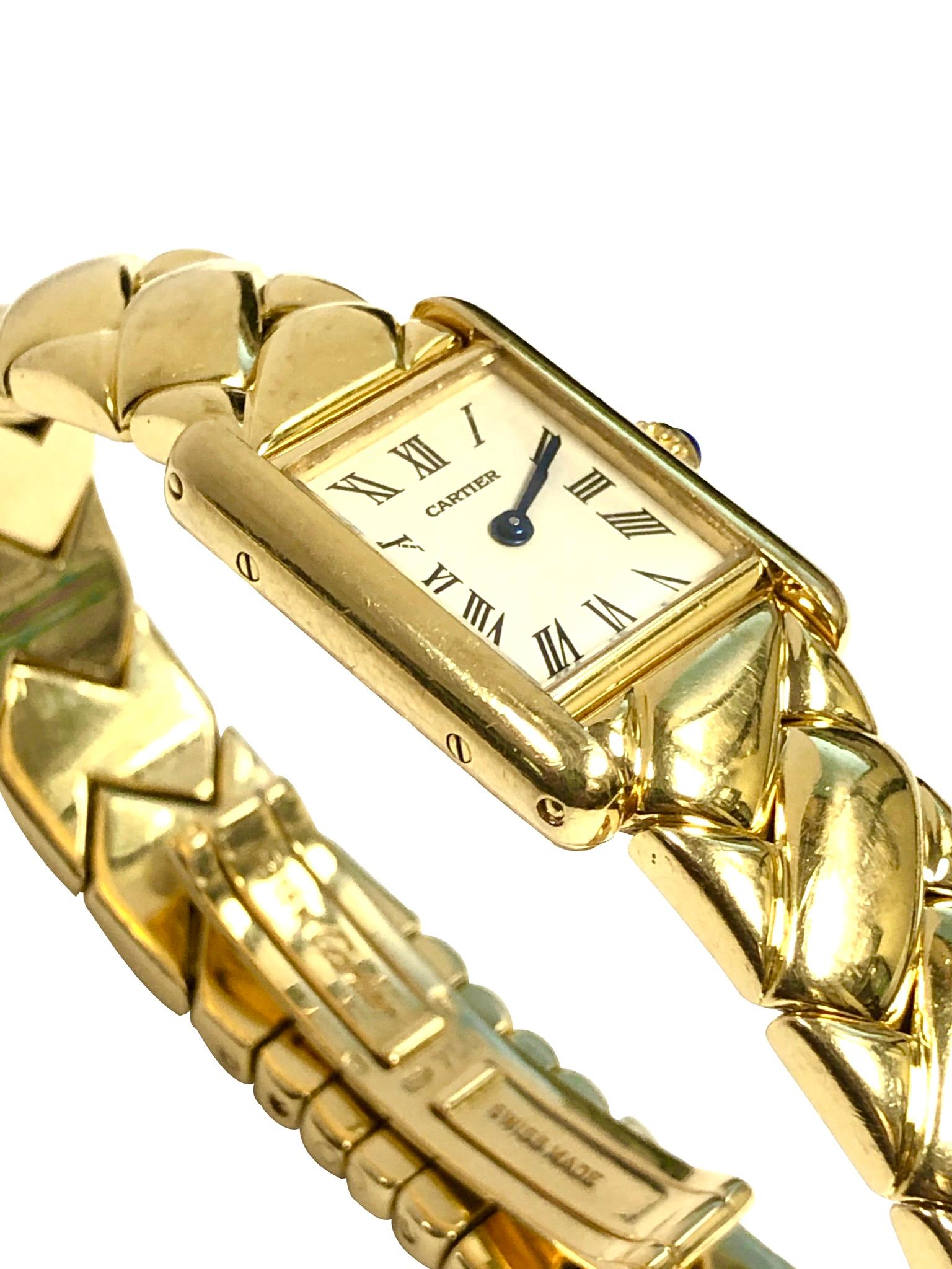 Circa 2000 Cartier Ladies Classic Tank Wrist Watch on limited edition Bracelet, 25 X 18 M.M. 18K Yellow Gold 2 Piece case, Quartz movement, White Dial with Black Roman Numerals, Sapphire Crown. 1/2 inch wide 18 K Yellow Gold LaDonna style link