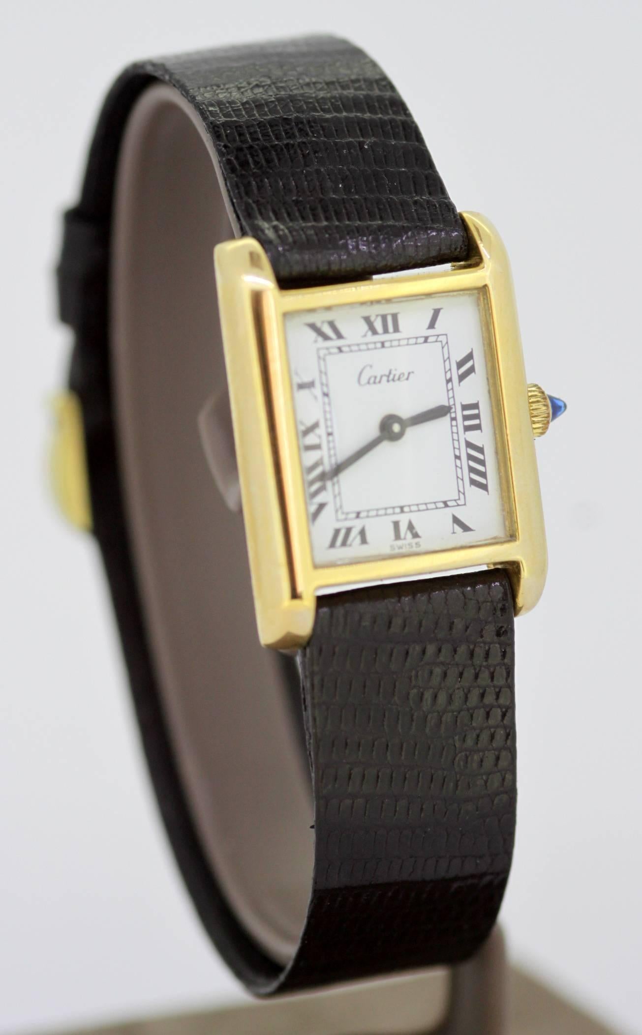 Cartier Ladies Gold Plated Manual Winding Wristwatch, C.1970's
Watch has been made in USA.

Ref : 25705 / 5512106 / 21682
Gender: Ladies
Case Size (No crown) : 28 x 22 mm
Movement: Manual Winding
Watchband Material: Original Cartier leather
Case