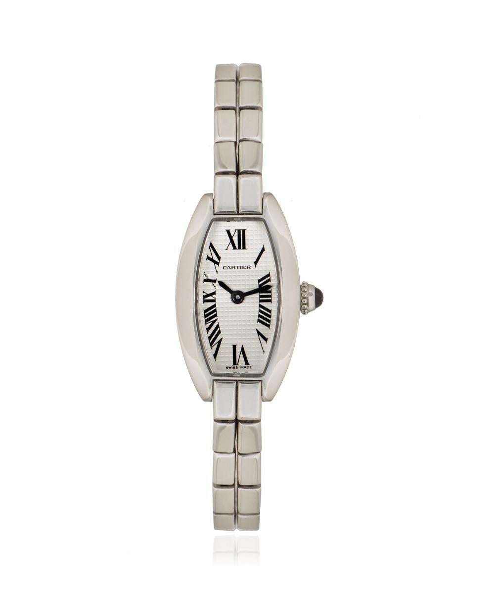 A 16mm ladies Lanieres crafted in white gold by Cartier. Featuring a silver guilloche dial with roman numerals and a hidden Cartier signature at 'X'. Complimenting the dial is a fixed white gold bezel set with a cabochon crown. 

Fitted with a
