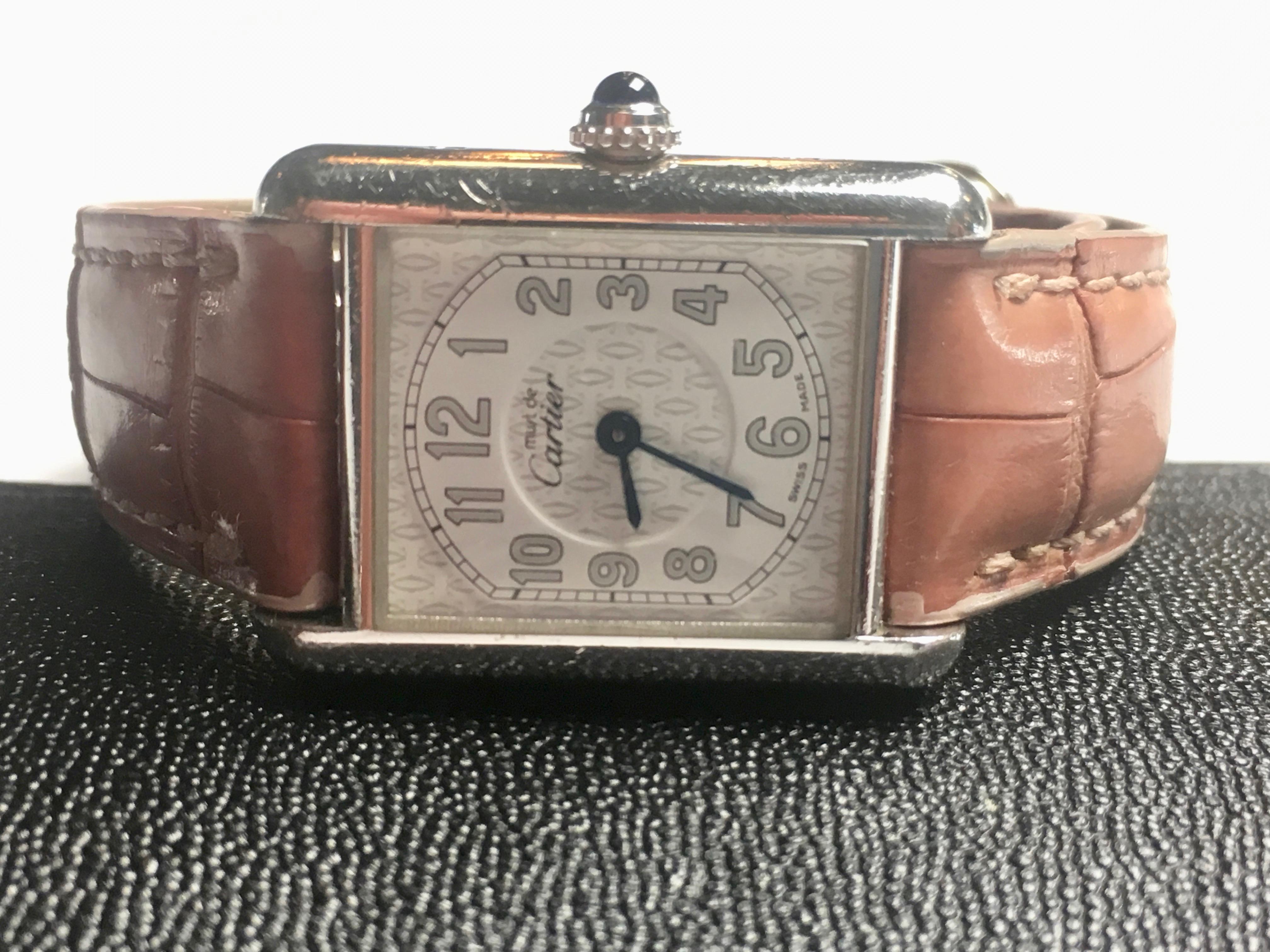 Classic Must de Cartier tank wristwatch made of Sterling Silver. Circa 2006. Pink crocodile band. Quartz movement with deployment buckle. Model 2416. Serial number, model number and Cartier logo engraved on case. Sold with original COA along with