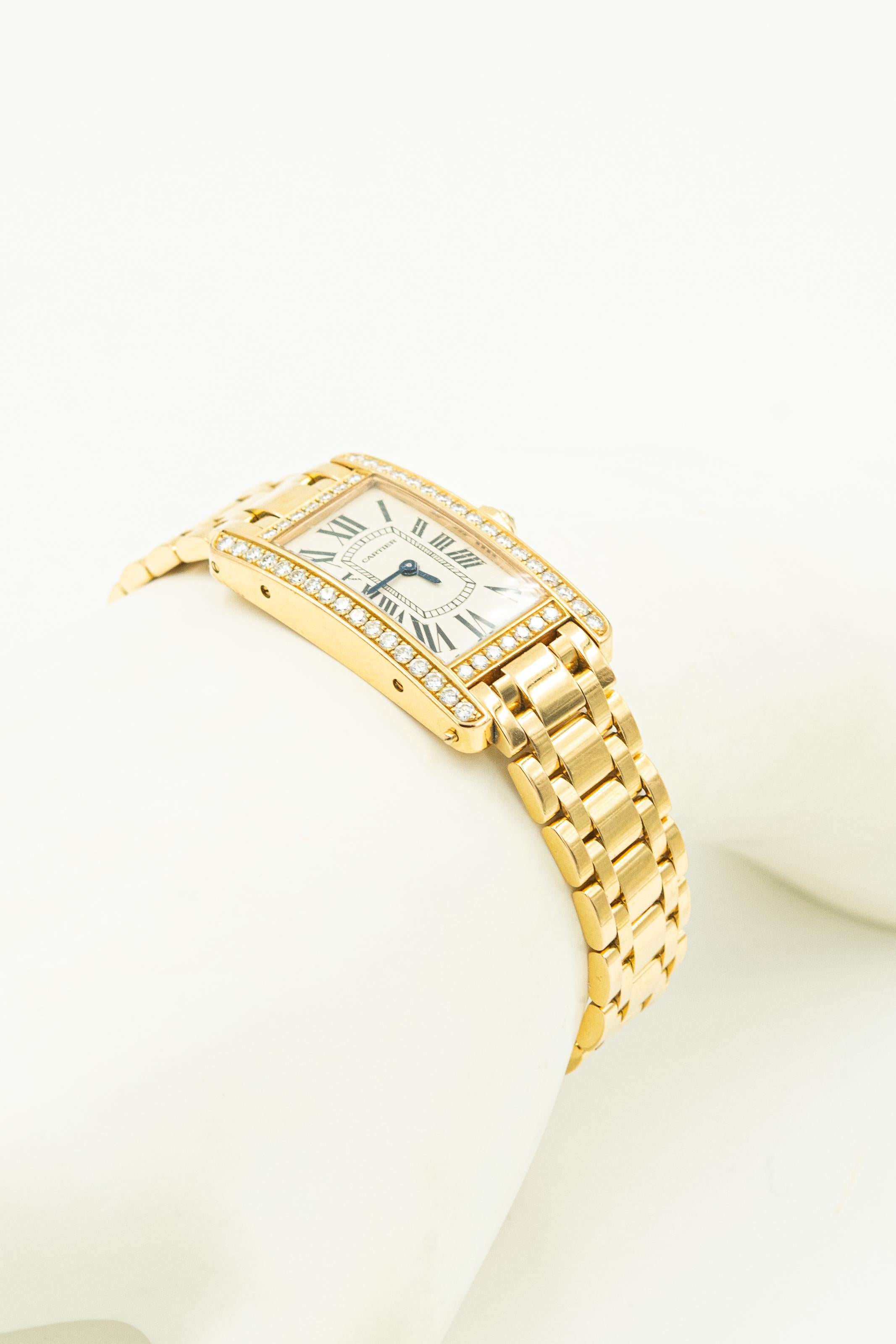 Cartier Ladies Tank Americane 18k Yellow Gold Ref. 2503 Serial 9903CE bezel framed with 48 round brilliant diamonds in bezel and a sapphire crystal. It has a dual clasp 18k yellow gold bracelet.
Movement: Swiss quartz
Measurements: 19mm X 25mm (35mm