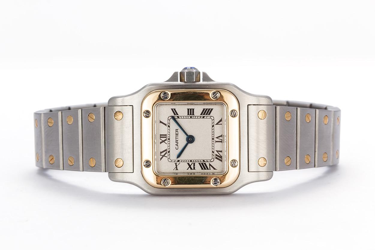 We are pleased to offer this Cartier Ladies Two Tone 18K Gold & Steel Santos Galbee Watch. It features a quartz movement and 18k yellow gold and stainless steel two tone design with the classic Cartier santos styling. It will fit up to a 6.75