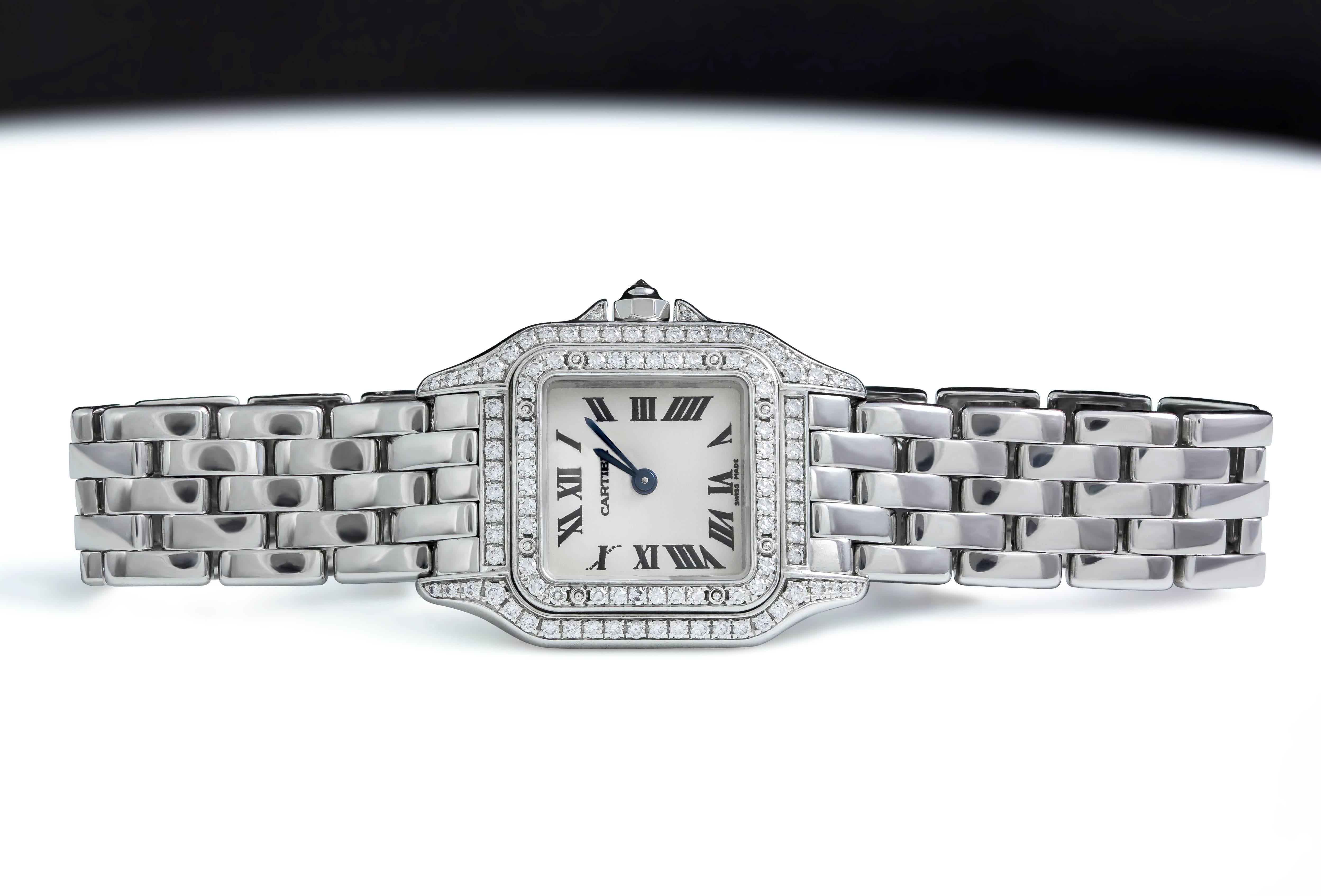 A small classic ladies wristwatch made and signed by Cartier (ref: 1660). Features a classic Roman Dial with blue steel hands set in a solid 18k white gold bezel and a 22mm x 30mm diamond encrusted case. A single round diamond set on the crown and