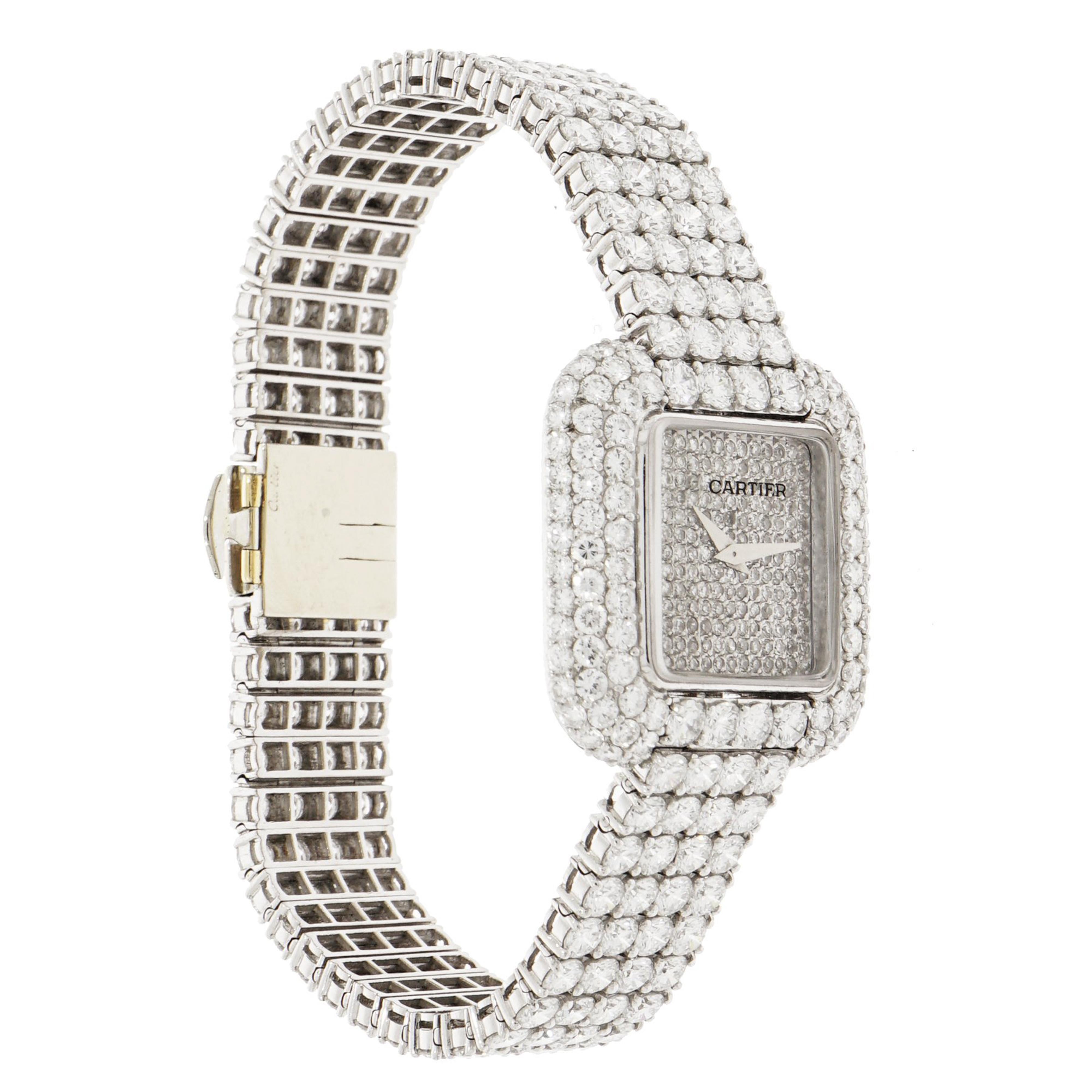 Magnificent  Cartier watch with four rows of diamonds on the bracelet. The dial is hand crafted and set in 18k white gold. This timepiece features a manually wound movement by Vacheron Constantin with indications for the Hours and Minutes.  The case