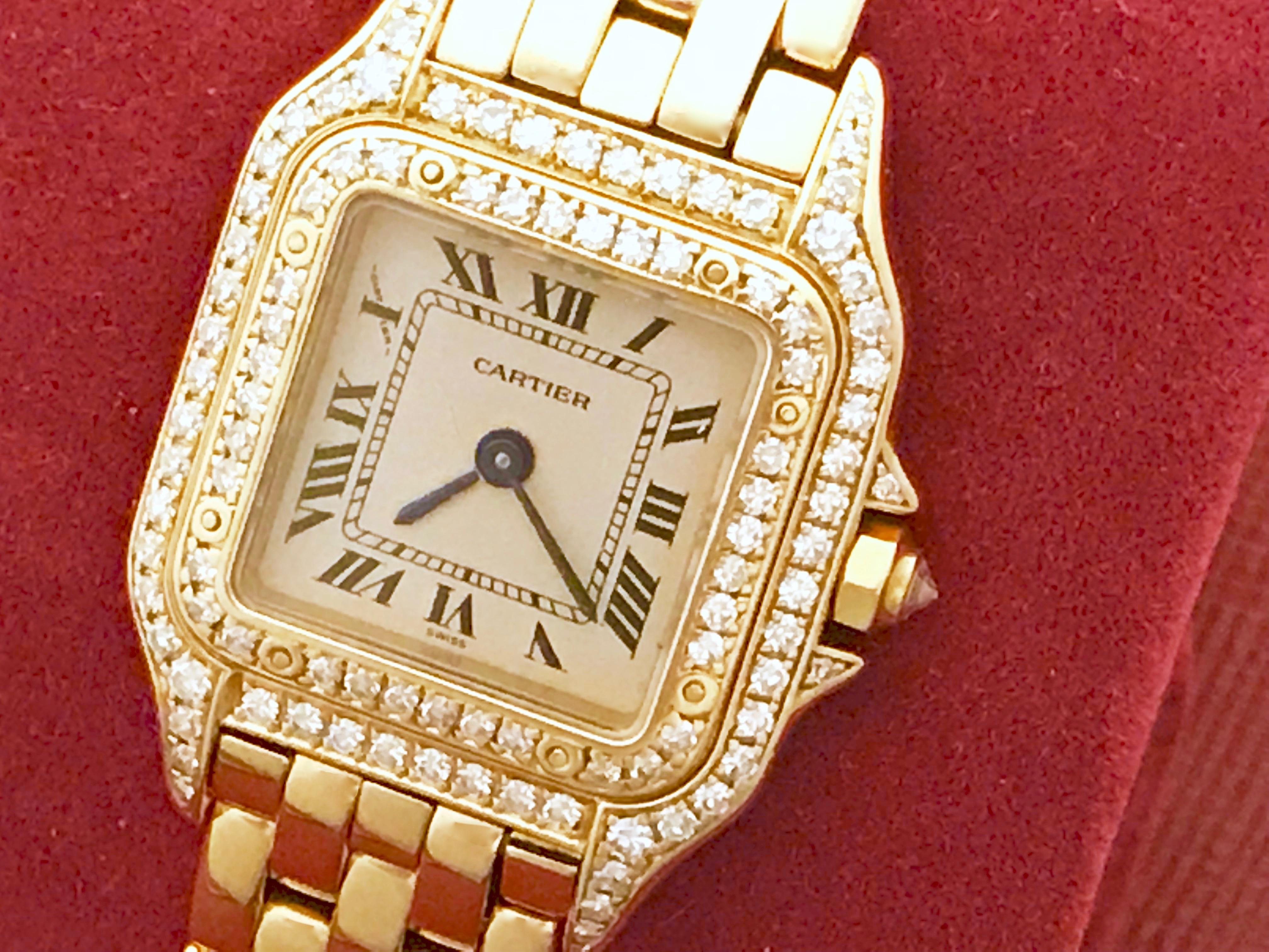 Cartier Ladies Panther 18K Yellow Gold ladies diamond wrist watch. As new, Certified pre-owned and ready to ship.  Quartz movement, 18k Yellow Gold square style Cartier Diamond case, Diamond bezel and Diamond cabochon setting crown (21x30mm).  18K
