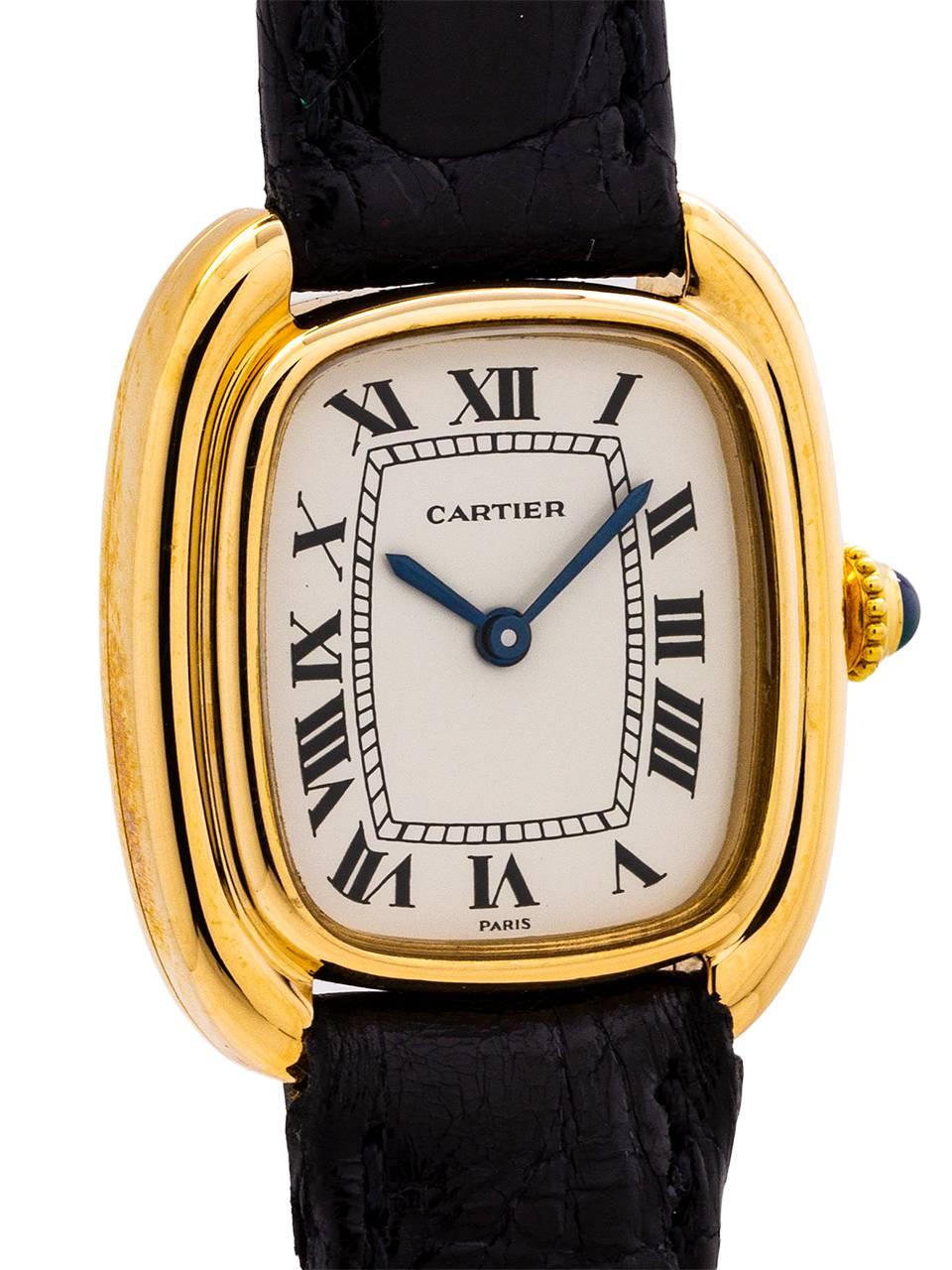 
Cartier 18K YG lady Gondole model circa 1980’s. Scarce and great looking elongated cushion shaped case with stepped and grooved sides. With mineral glass crystal and original glossy white classic Cartier dial with Roman figures and blued steel
