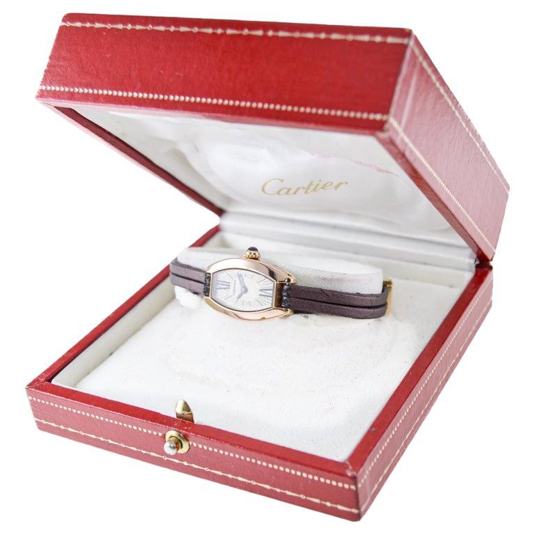 FACTORY / HOUSE: Cartier Watch Company
STYLE / REFERENCE: Lanieres
MOVEMENT / CALIBER: Quartz
DIAL / HANDS: Factory Original Silvered Dial with Roman Numeral and Baton Markers / Blued Steel Hands
DIMENSIONS: Length 28mm X Width 16mm
ATTACHMENT /