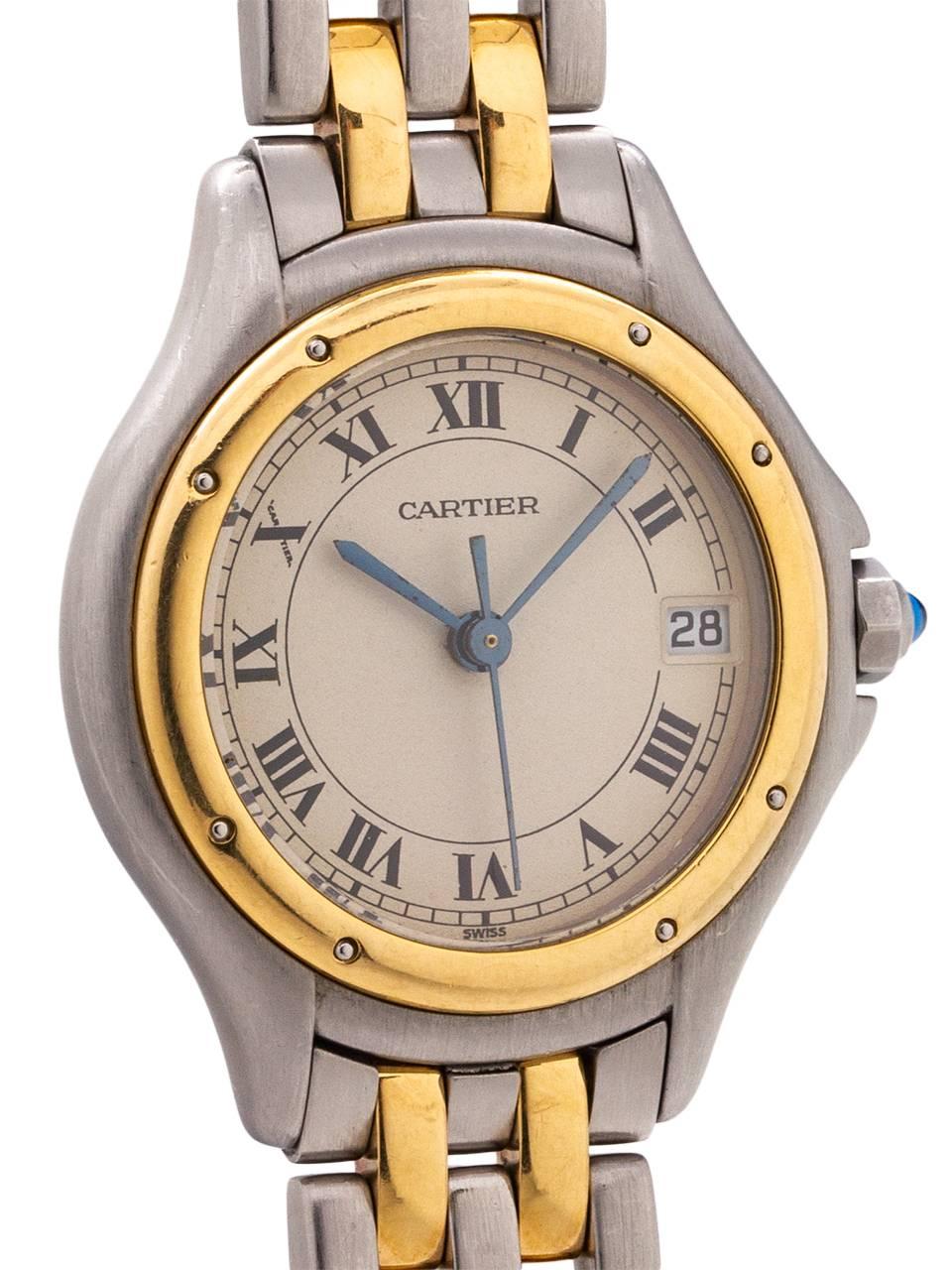 
Cartier lady’s Cougar model SS/18K YG circa 1980’s. Featuring round 27mm diameter case with rounded stepped bezel secured by screws, antique white dial with classic Cartier Roman figures and blued steel hands. Powered by quartz movement with sweep