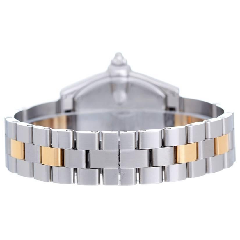 Cartier Roadster Steel & Gold Ladies Small 30mm Quartz Watch W62026Y4 - 2-tone stainless steel and 18k yellow gold case (30mm x 36mm). 2-tone stainless steel and 18k yellow gold case (30mm x 36mm). Silver dial with black Roman numerals; date at 3