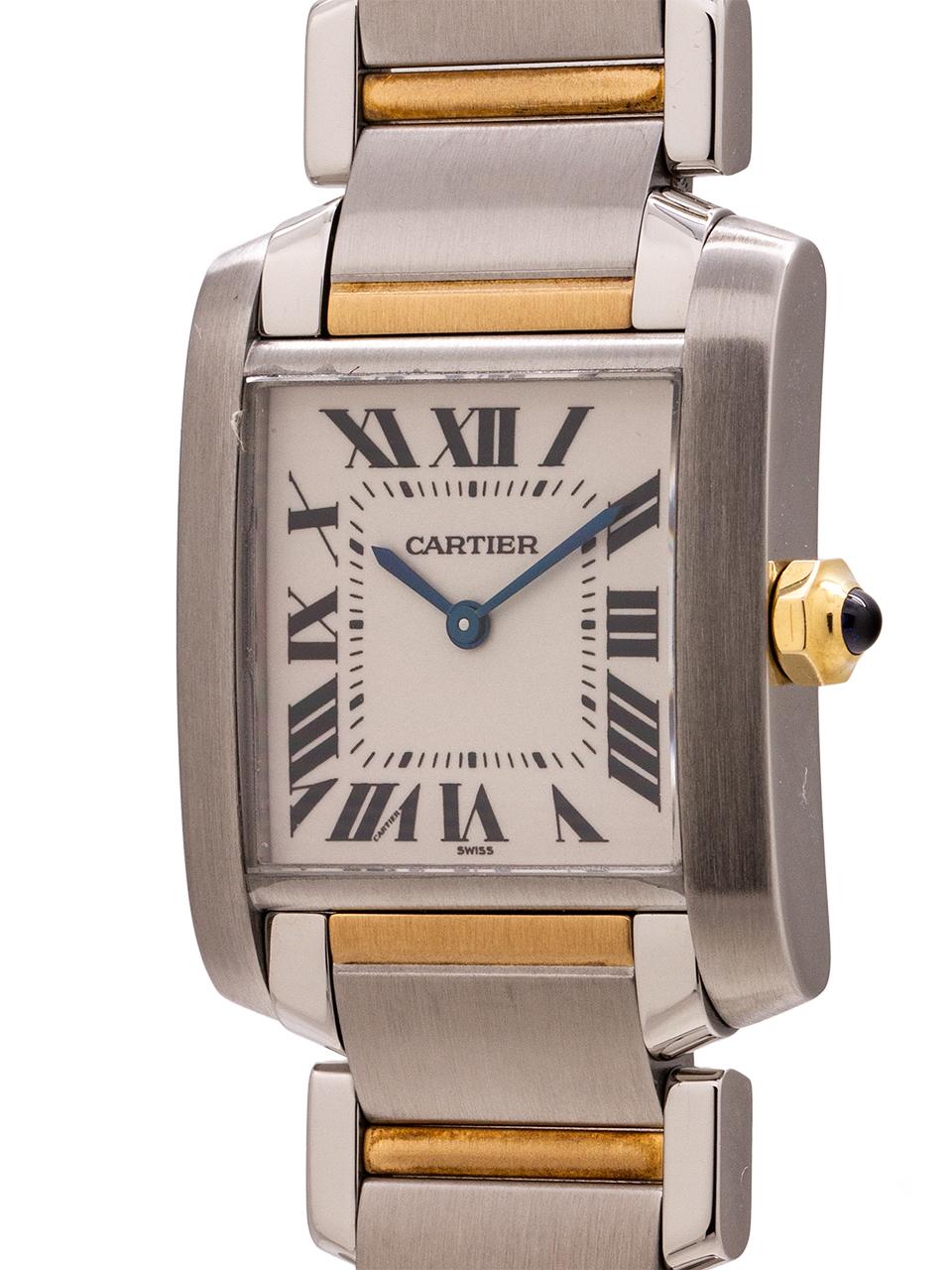 
Cartier stainless steel & 18K YG midsize Tank Francaise circa 2000. This is the midsize 26 X 35 mm case sporty size model for women. Featuring a classic white dial with Roman numerals and blue steel hands and sapphire cabachon crown. Battery