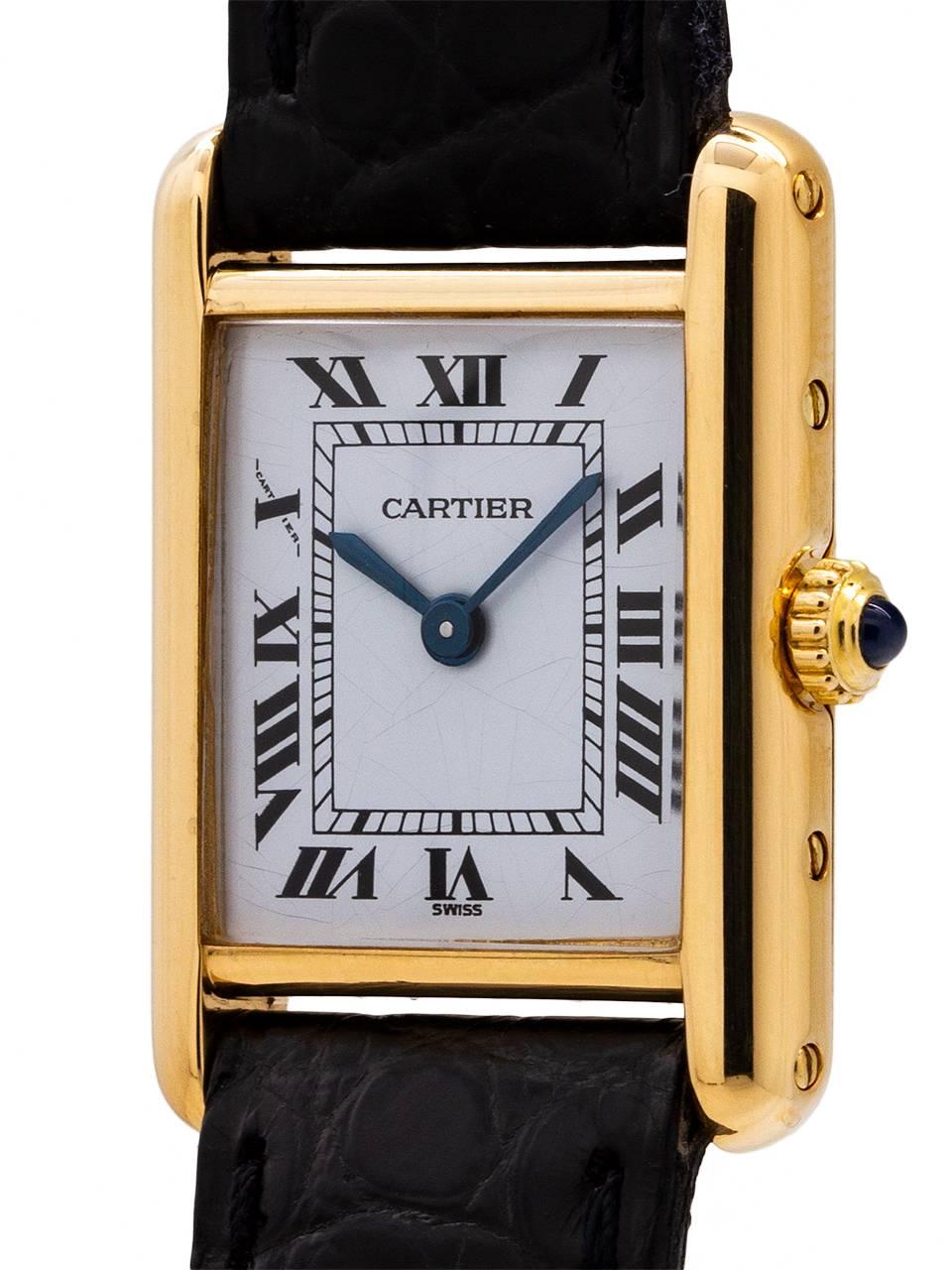 
Cartier Lady’s 18K gold Tank Louis circa 1970’s. Featuring 20.5 X 28mm case secured by 4 screws. Classic early silvered and finely grained original dial signed Cartier with black Roman numerals and blued steel hands and signed SWISS. The dial has