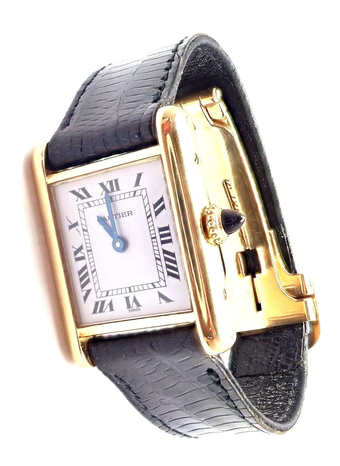 Lady's 18k yellow gold Cartier Tank wristwatch.
Details: 
Brand: Cartier
Case Material: 18k Yellow Gold
Dial Color: White
Movement: Manual Wind
Functions: Hours, Minutes
Crystal: Cartier mineral glass crystal
Case: 28mm x 21mm
Crown: Sapphire
Strap: