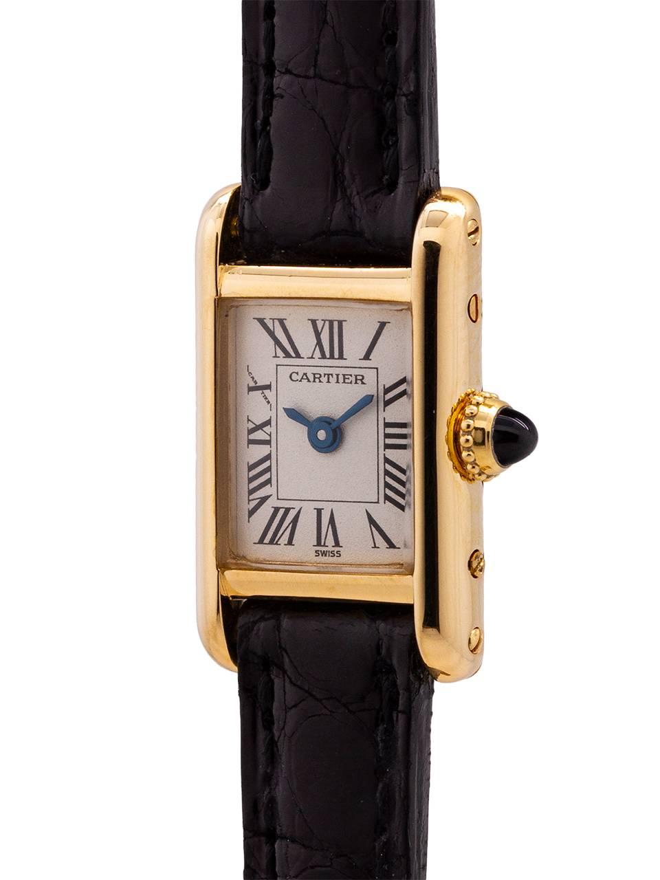
Classic vintage circa 1980’s Cartier Lady’s 18K gold Tank Louis “mini” with quartz movement. Featuring a petite 19 x 24mm rectangular case secured by 4 side and 4 back case screws, and featuring an extremely nice condition classic original white