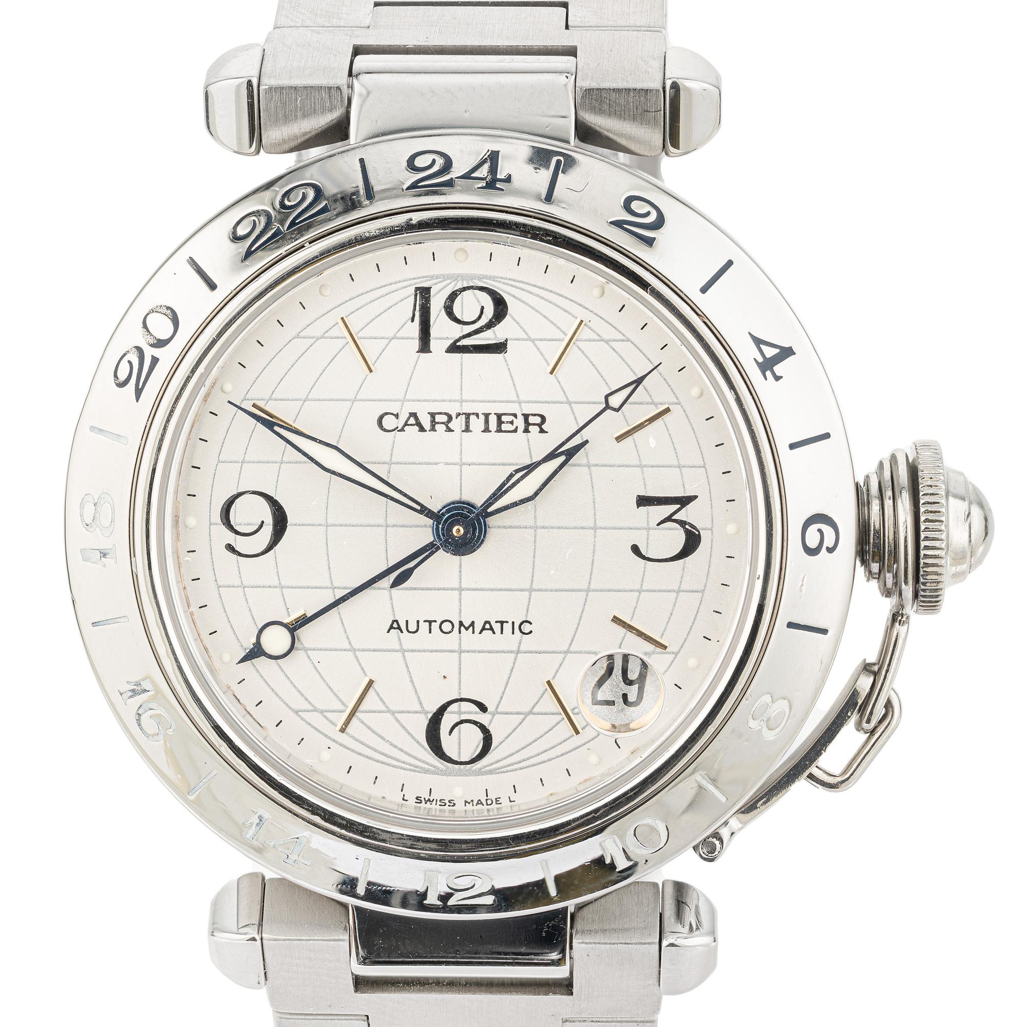 Reloj de pulsera Cartier Lady Pasha GMT Automático de acero inoxidable. Este exquisito reloj encarna la sofisticación y la funcionalidad. Con movimiento automático, esfera redonda blanca y fecha. Cinta de acero y cadena de seguridad de la tapa de
