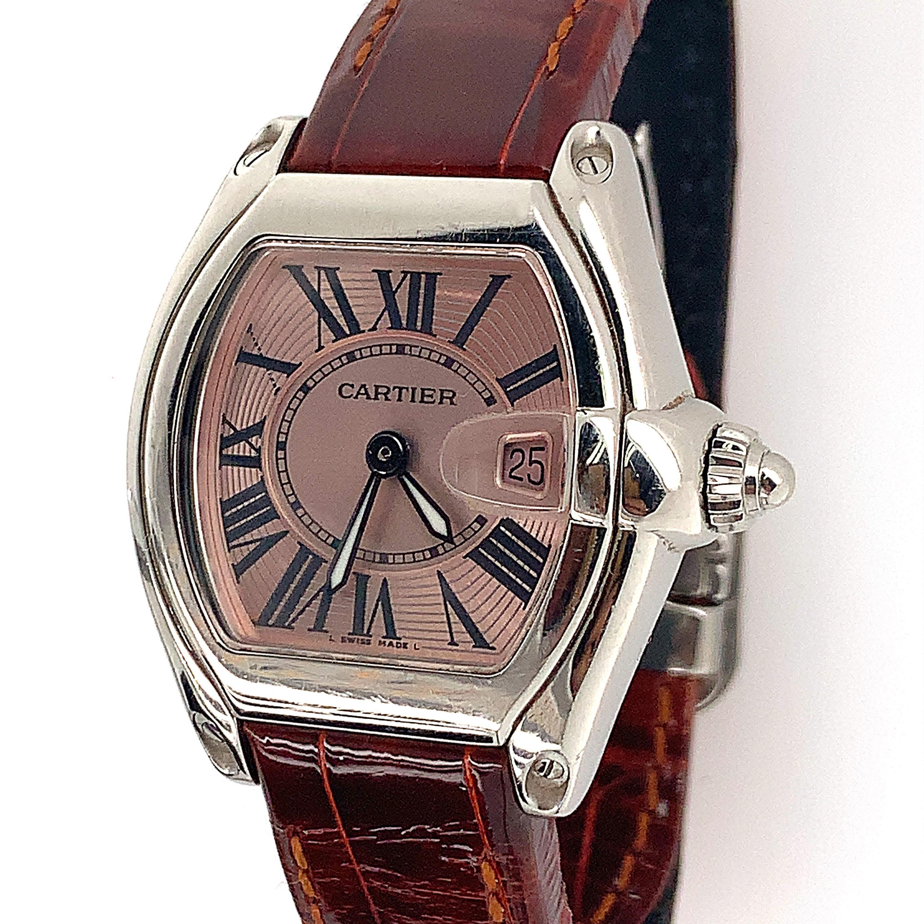 Stainless Steel Quartz pink dial, measures 36mm x 30mm with original Cartier band and deployment buckle.