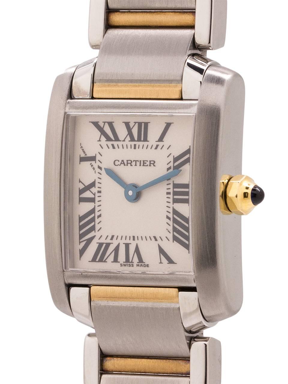 
Cartier stainless steel and 18K YG Lady Tank Francaise ref 2334 circa 2000’s. 20 X 25mm case with sapphire crystal and blue sapphire cabachon crown. Classic antique white dial with Roman numerals and blue steel hands. Powered by battery quartz