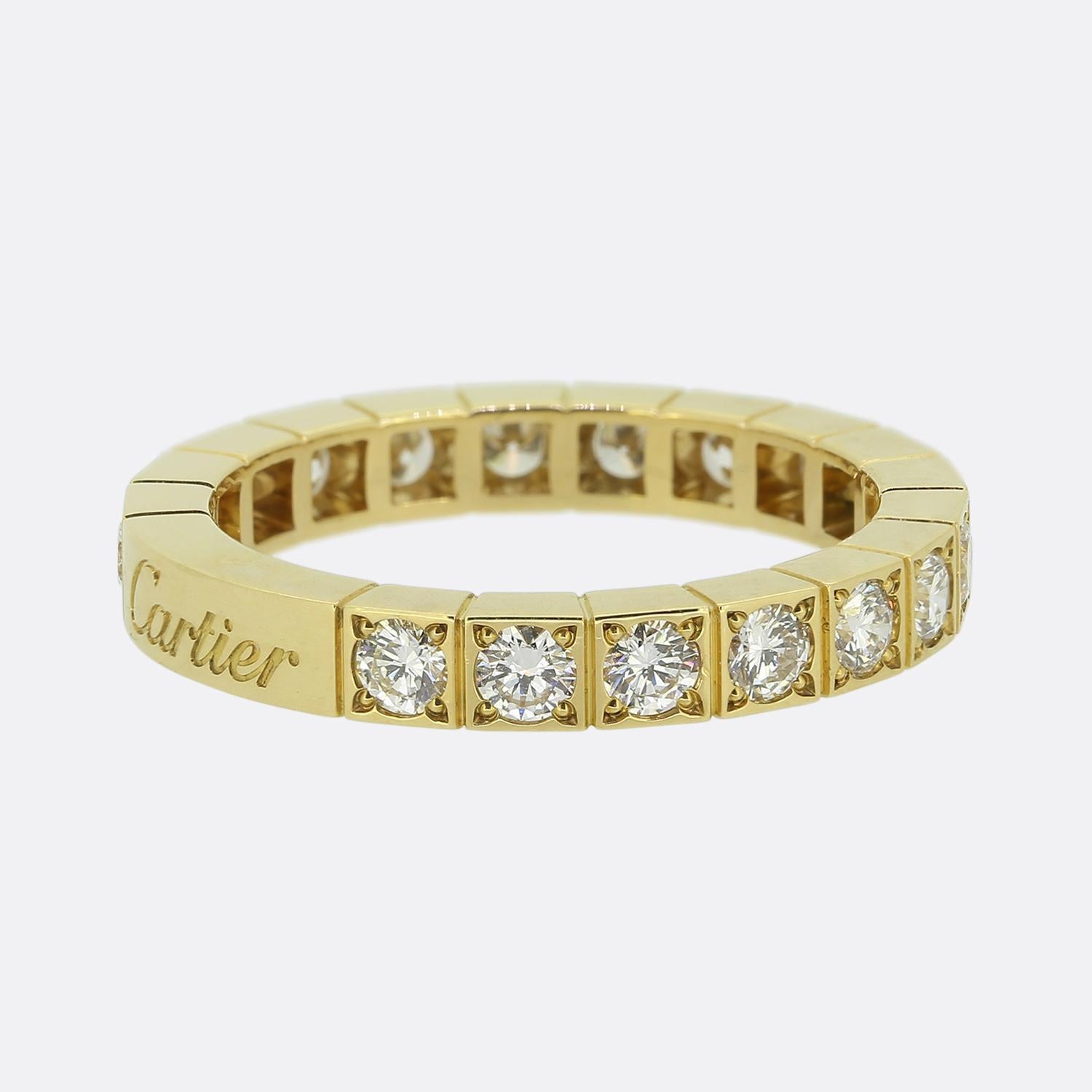 Here we have an 18ct yellow gold band ring from the world renowned luxury jewellery house of Cartier. This piece forms part of the Lanieres collection and features a segmented boxed design; each set with a single round brilliant cut diamond before