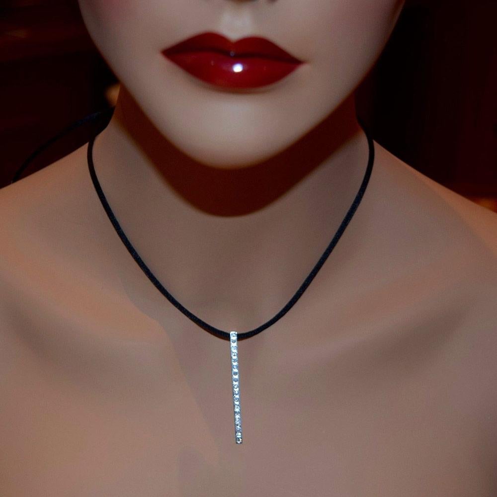 Designer: Cartier

Collection: Lanières

Metal: White Gold

Metal Purity: 18k

Stones: 17 Round Brilliant Cut Diamonds

Total Carat Weight: 1.5 ct


Necklace Length: 27.25 inches (adjustable) 

Necklace Strap Material: Black Velvet Rope

Pendant
