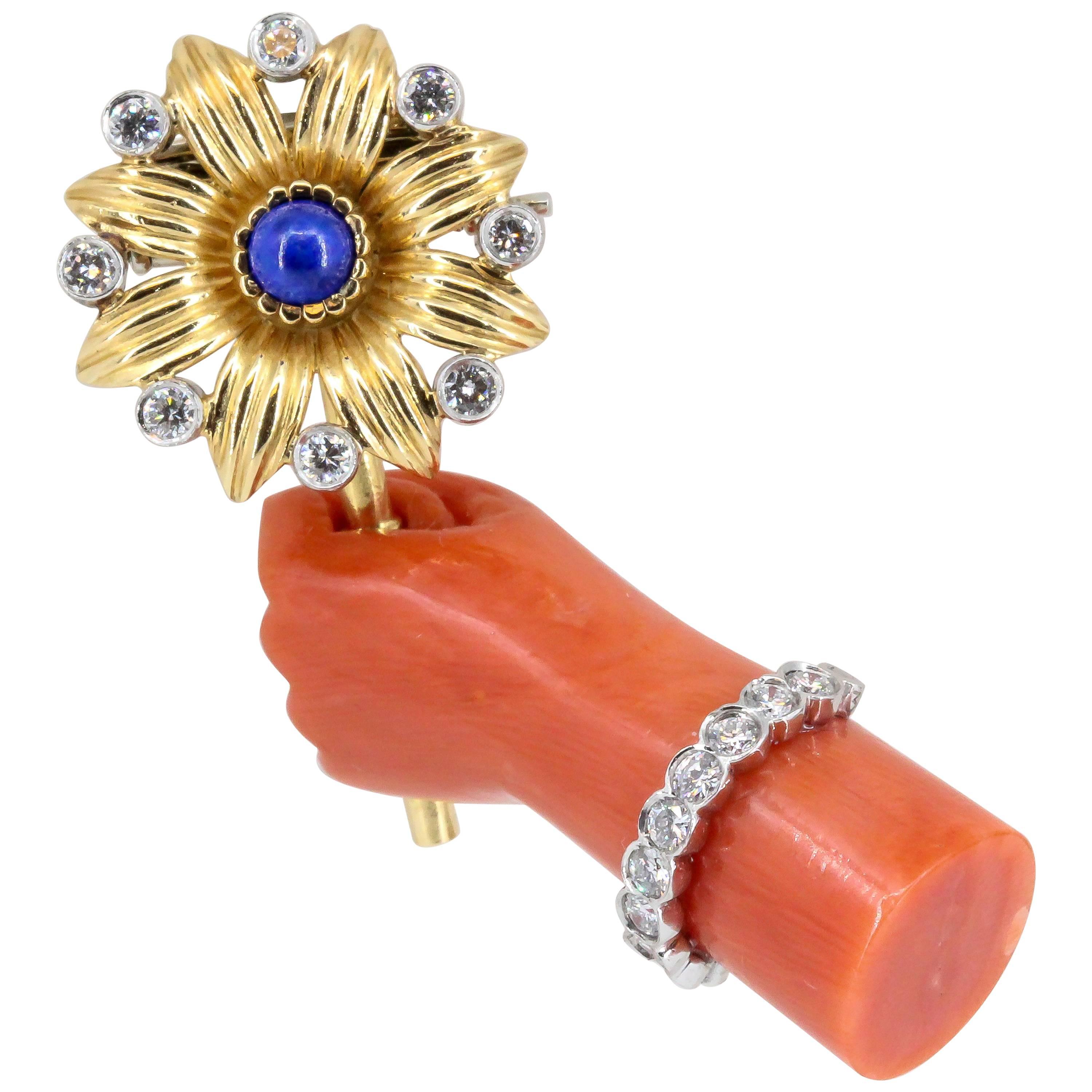 Cartier Lapis, Diamond, Coral Platinum and Gold Hand Holding Flower Brooch For Sale