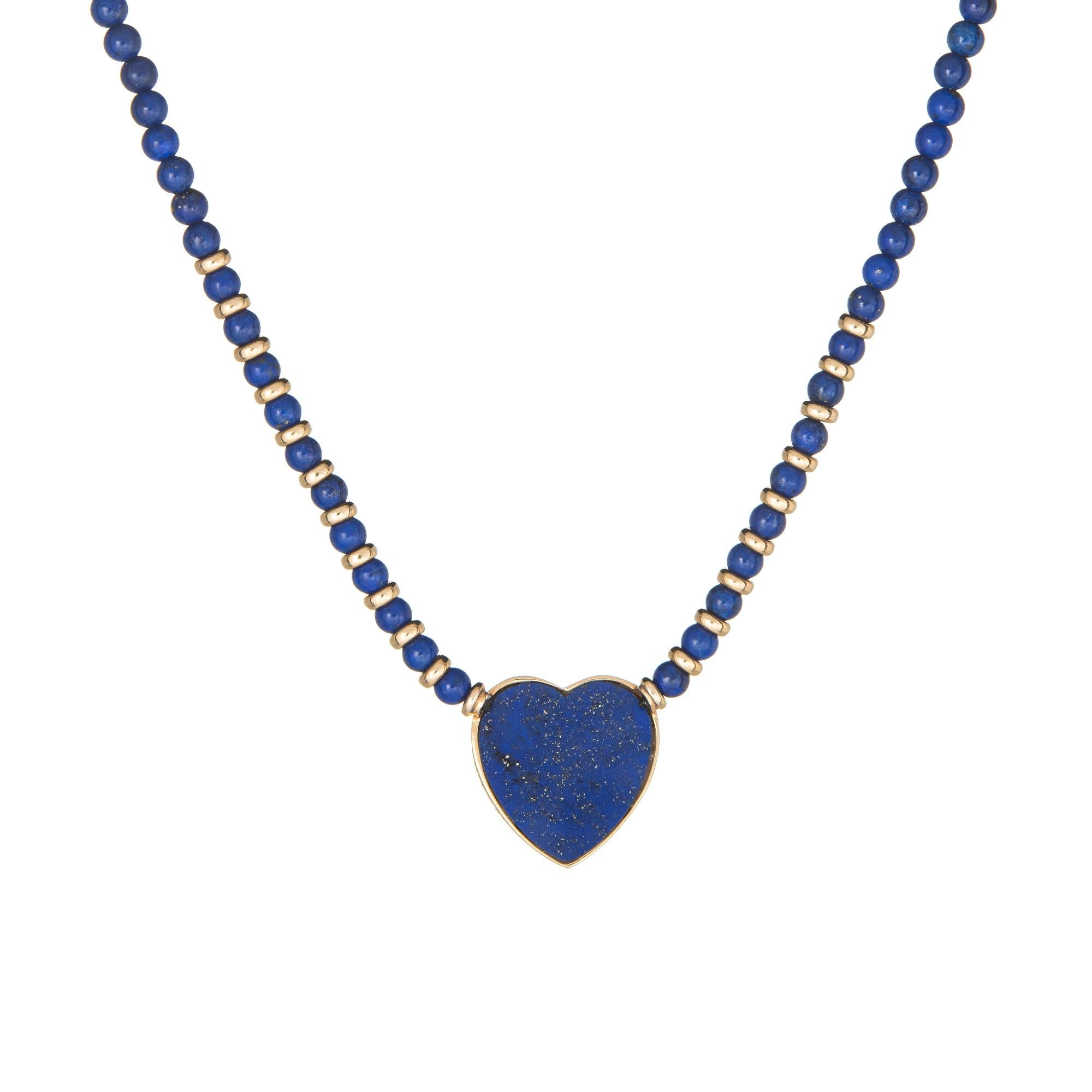 Finely detailed vintage Cartier lapis lazuli heart necklace crafted in 18 karat yellow gold. 

Lapis lazuli beads each measure 3mm with lapis inlaid into the heart.

The necklace is a retired piece and no longer available for sale at retail. The