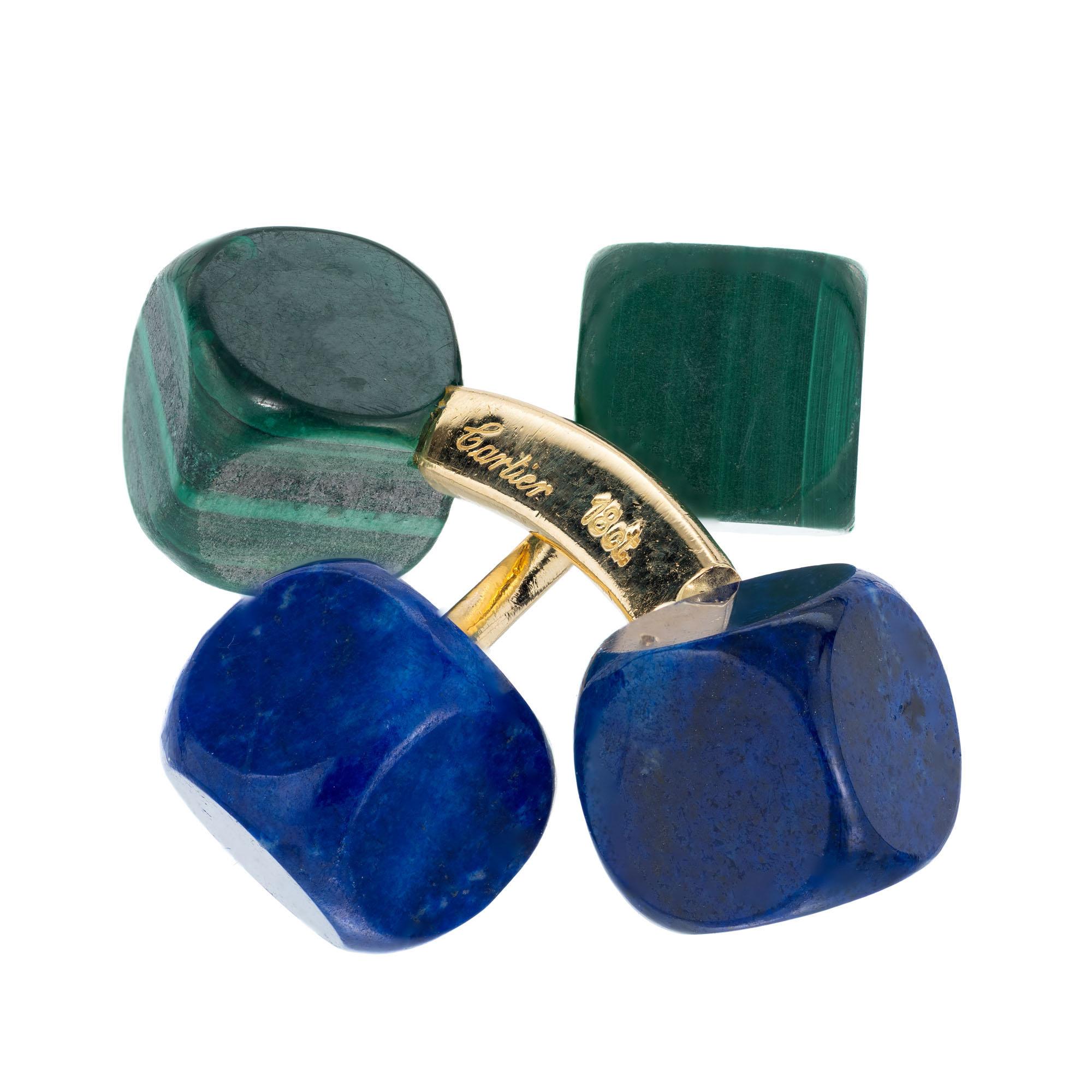 Cartier 1960’s natural double-sided cufflinks with lapis and malachite in 18k yellow gold. Made in Germany

2 lapis cubes 8mm
2 malachite cubes 8mm
18k yellow gold 
Stamped: 18k
Hallmark: Cartier Germany
Top to bottom: 11.2mm or .5 Inches
Width: