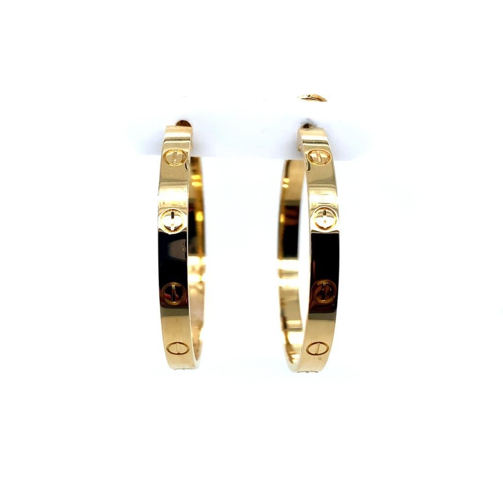 A pair of Cartier large Love earrings in 18 karat yellow gold.

A classic pair of Cartier earrings, in an extra large hoop size featuring the iconic Love Design, crafted in 18 karat yellow gold with stud and French fittings.

Signed 