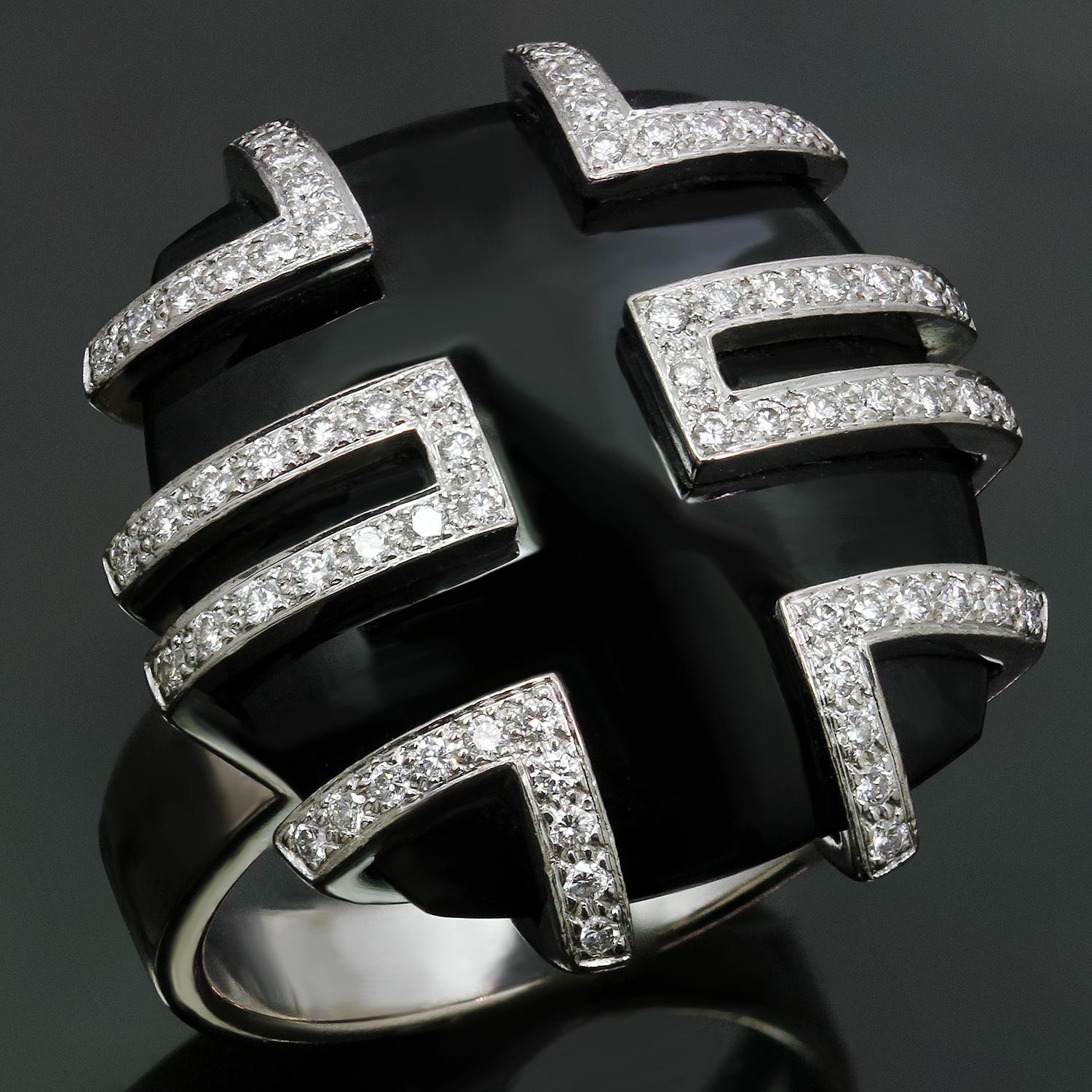 This spectacular ring from Cartier's iconic Le Baiser du Dragon is inspired by gorgeous East Asian design elements, crafted in 18k white gold, set with a cushion-cut black jade and accented with round brilliant E-F-G VVS1-VVS2 diamonds. Made in