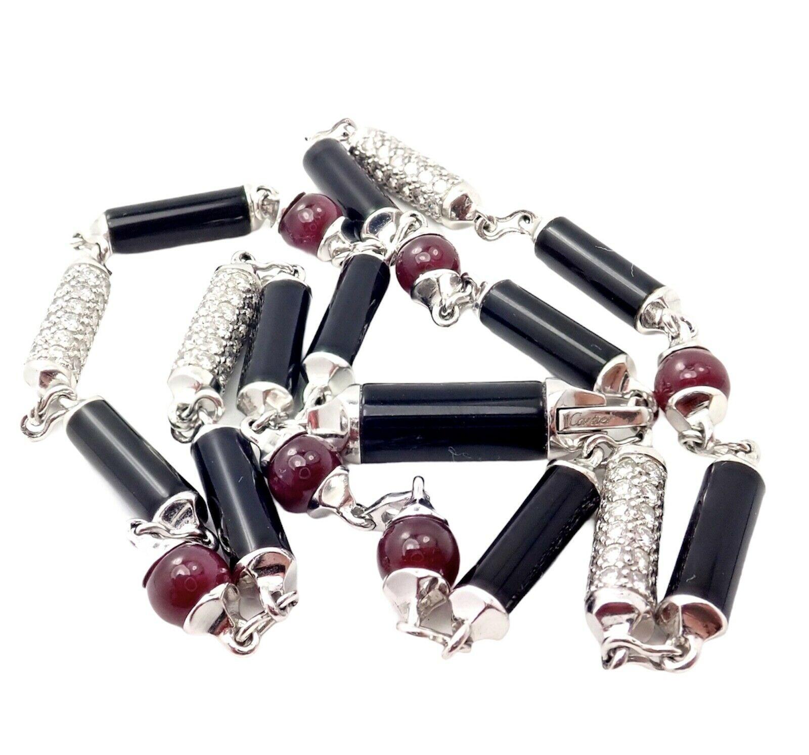 18k White Gold Diamond Black Onyx Ruby Necklace by Cartier. Part of Cartier's 