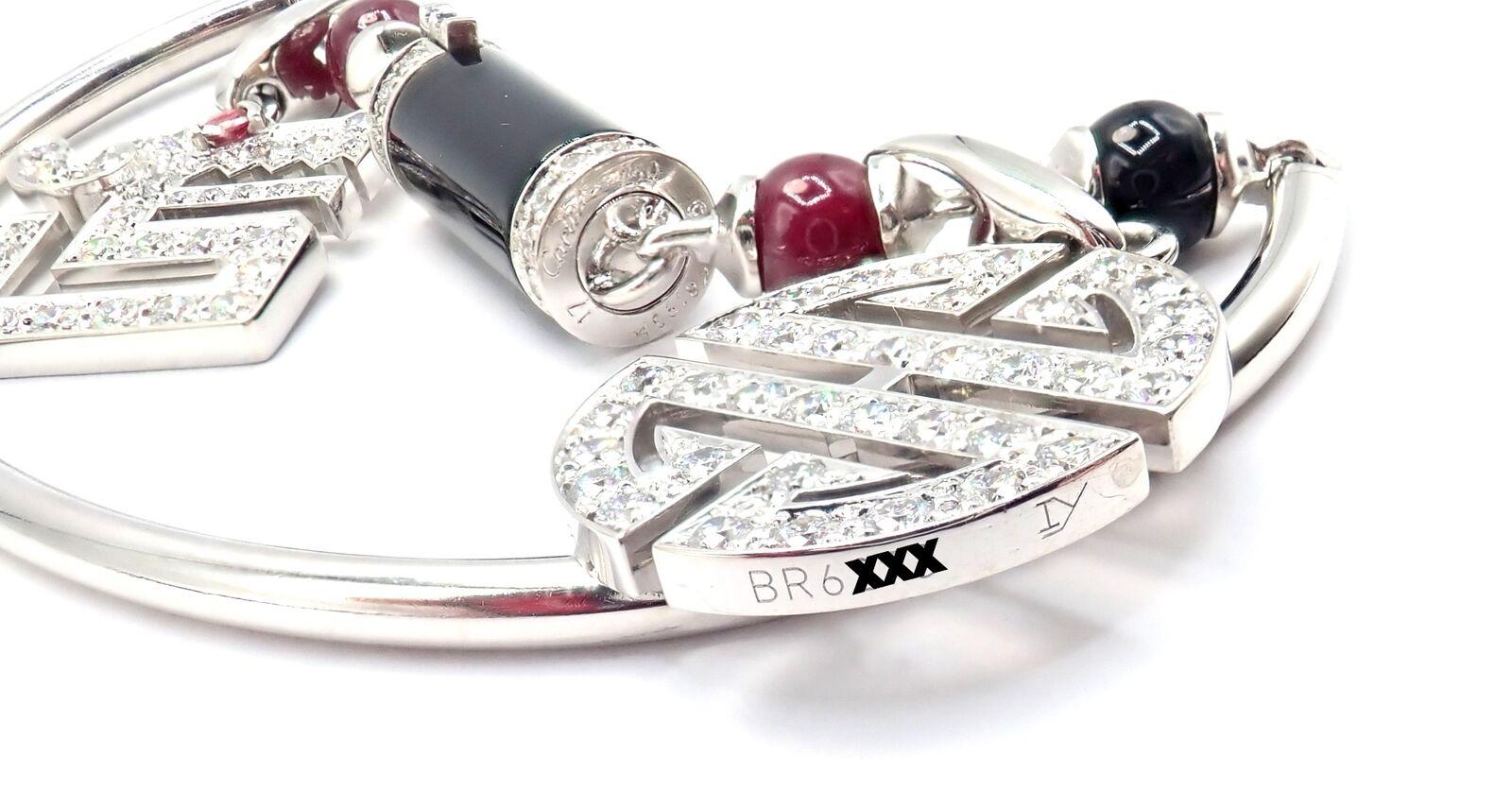 Cartier Bracelet Le Baiser Du Dragon à deux breloques en or blanc avec diamants, rubis et onyx Unisexe en vente