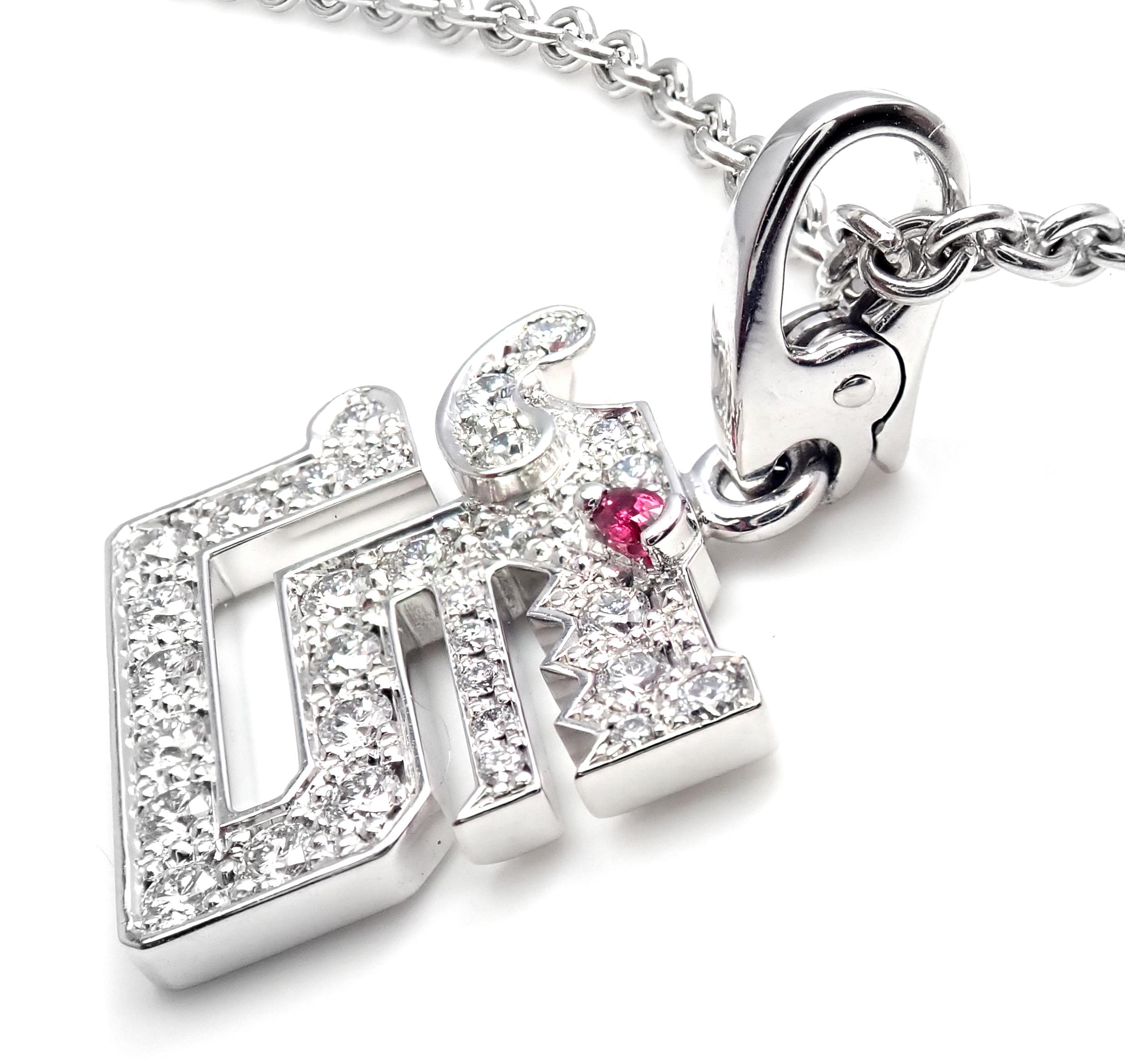 18k White Gold Diamond Baiser du Dragon Diamond Pendant Necklace by Cartier.
With 34 round brilliant cut diamonds VVS1 clarity, E color total weight approx. 1ct
1 round ruby approx. .10ct
Details:
Length: 16.5 inches long
Pendant is 16mm x