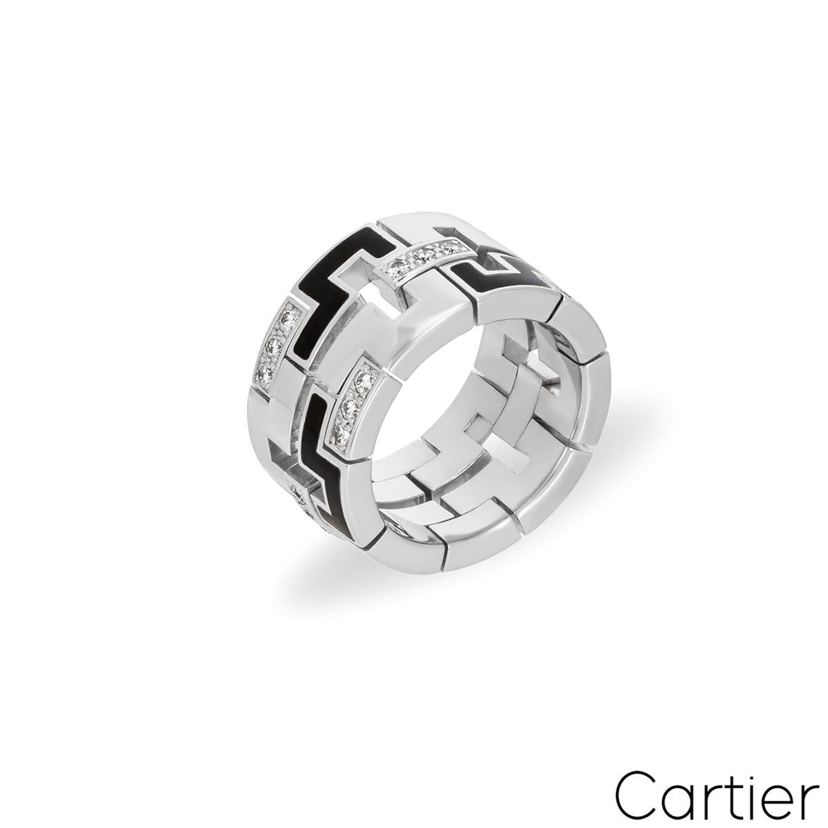 An 18k white gold dress ring from the Le Baiser Du Dragon collection by Cartier. The square abstract design alternates with polished, black enamel and round brilliant cut diamond set links. There are 27 round brilliant cut diamonds with a total