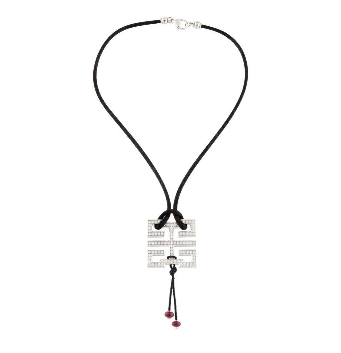 CARTIER Le Baiser du Dragon Pendant Necklace.


Metal Type: 18K White Gold

Marks: 750, Designer Signature, Registered Trademark Number, Serial Number

Metal Finish: High Polish, Rhodium-Plated

Total Item Weight (g): 18.5

Clasp Style: Lobster