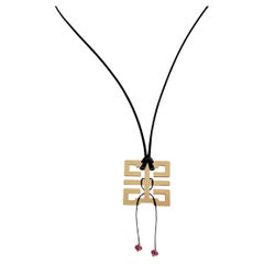 Collier Le Baiser du Dragon en or jaune et rubis de Cartier