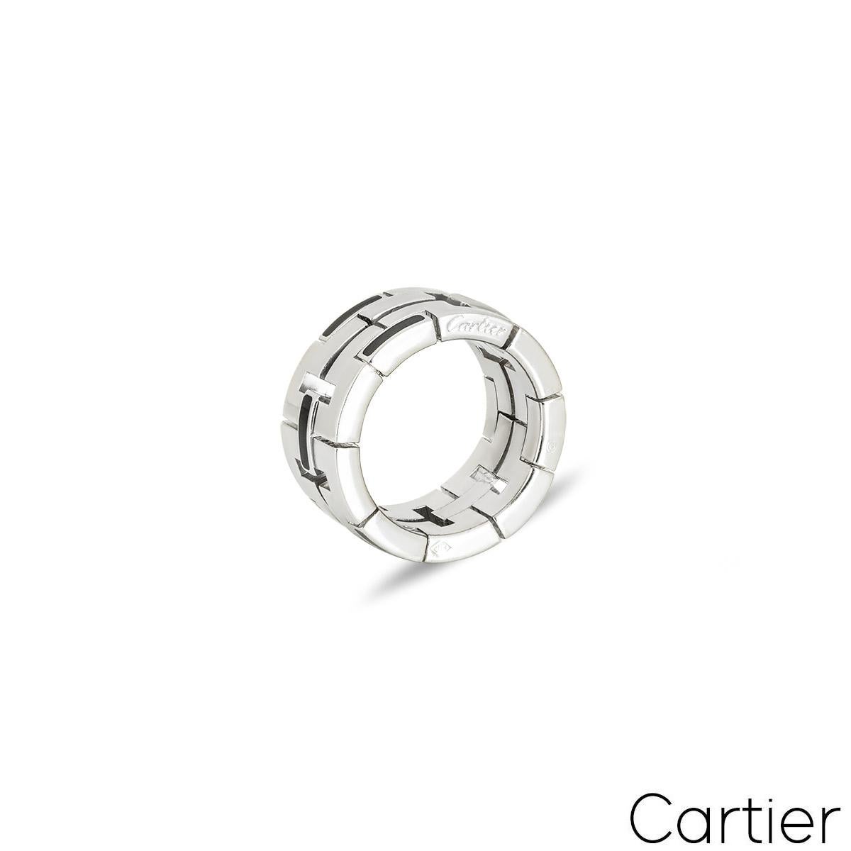 An 18k white gold dress ring from by Cartier from the Le Baiser Du Dragon collection. The square abstract design alternates with polished white gold and black enamel links. The ring measures 11mm in width and is a size UK H - EU 46 with a gross