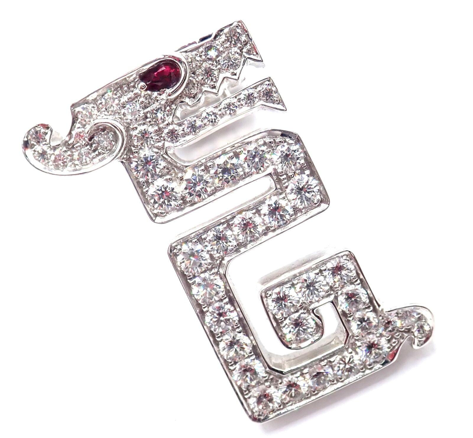 18k White Gold Le Baiser Du Dragon Diamond Ruby Pin Clip by Cartier.
With 52 Round brilliant cut diamonds VVS1 clarity E color total weight approx. .90ct and 1 ruby in the eye
Details:
Measurements: 23mm x 15.5mm
Weight: 8.5 grams
Stamped Hallmarks: